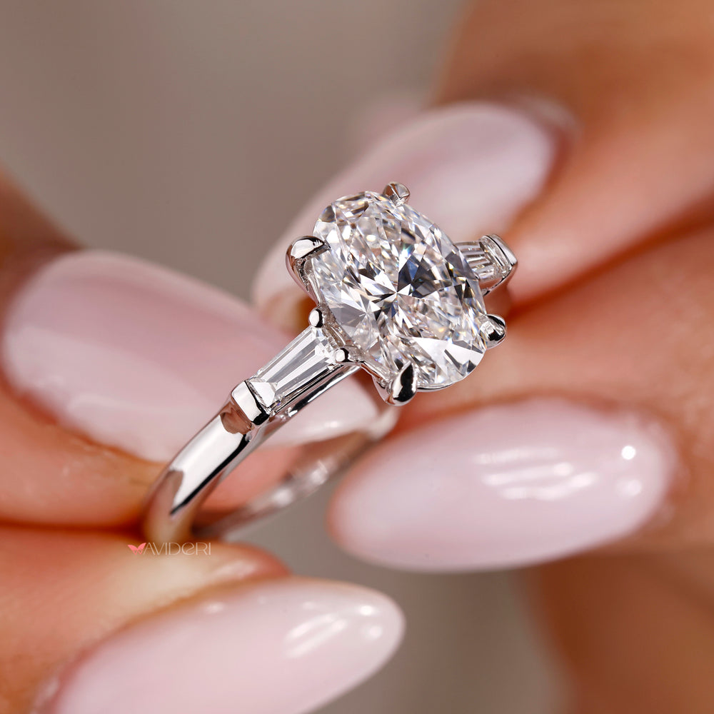 4 prong ring featuring an oval shaped diamond for a secure and radiant design.
