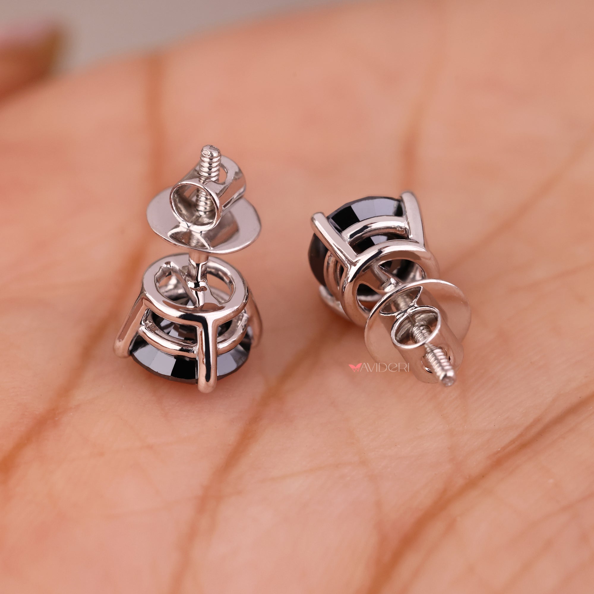 White gold stud earring featuring stunning round cut earrings design.