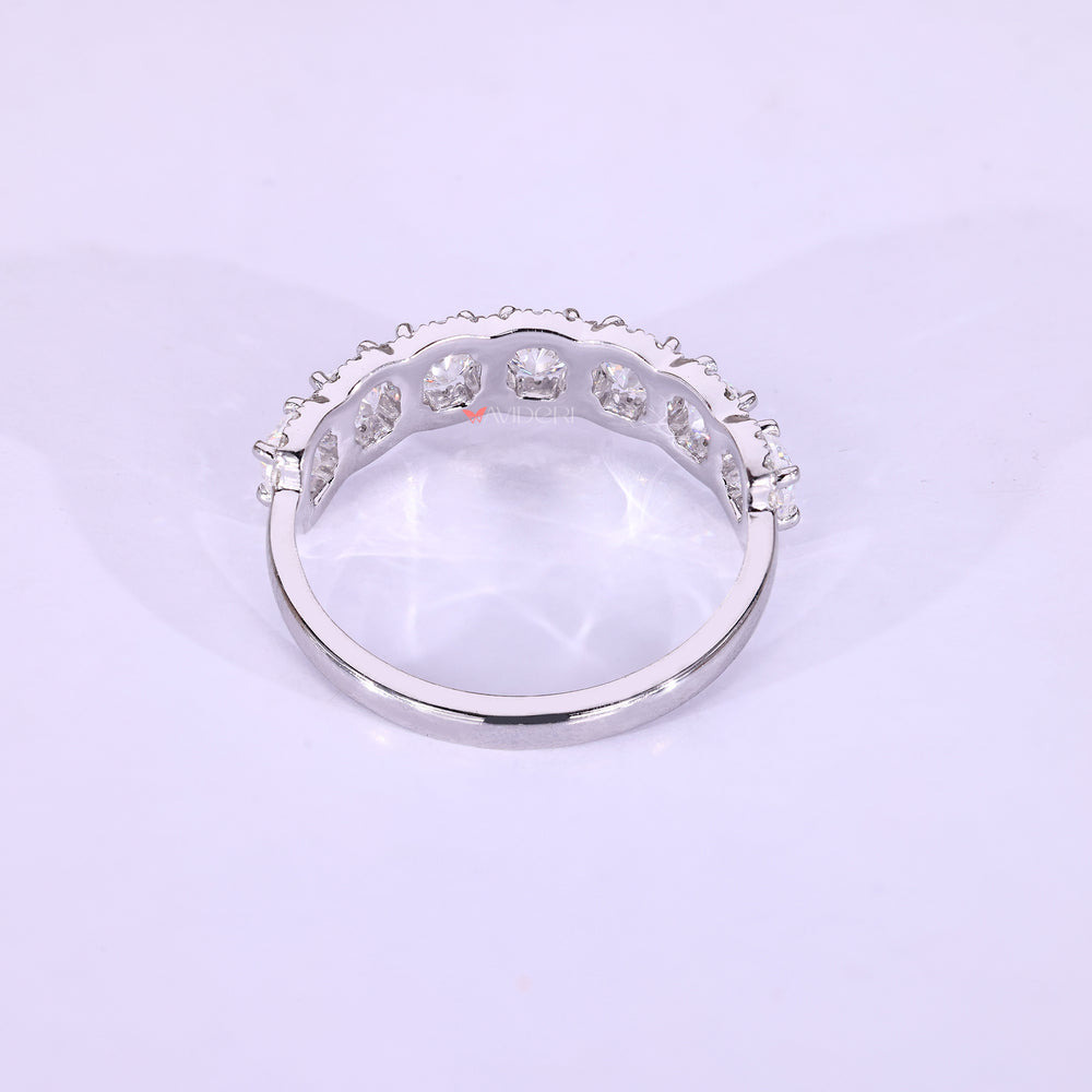 White gold wedding band with moissanite accents.