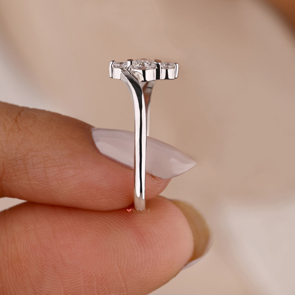 White gold engagement ring with a three stone engagement ring.
