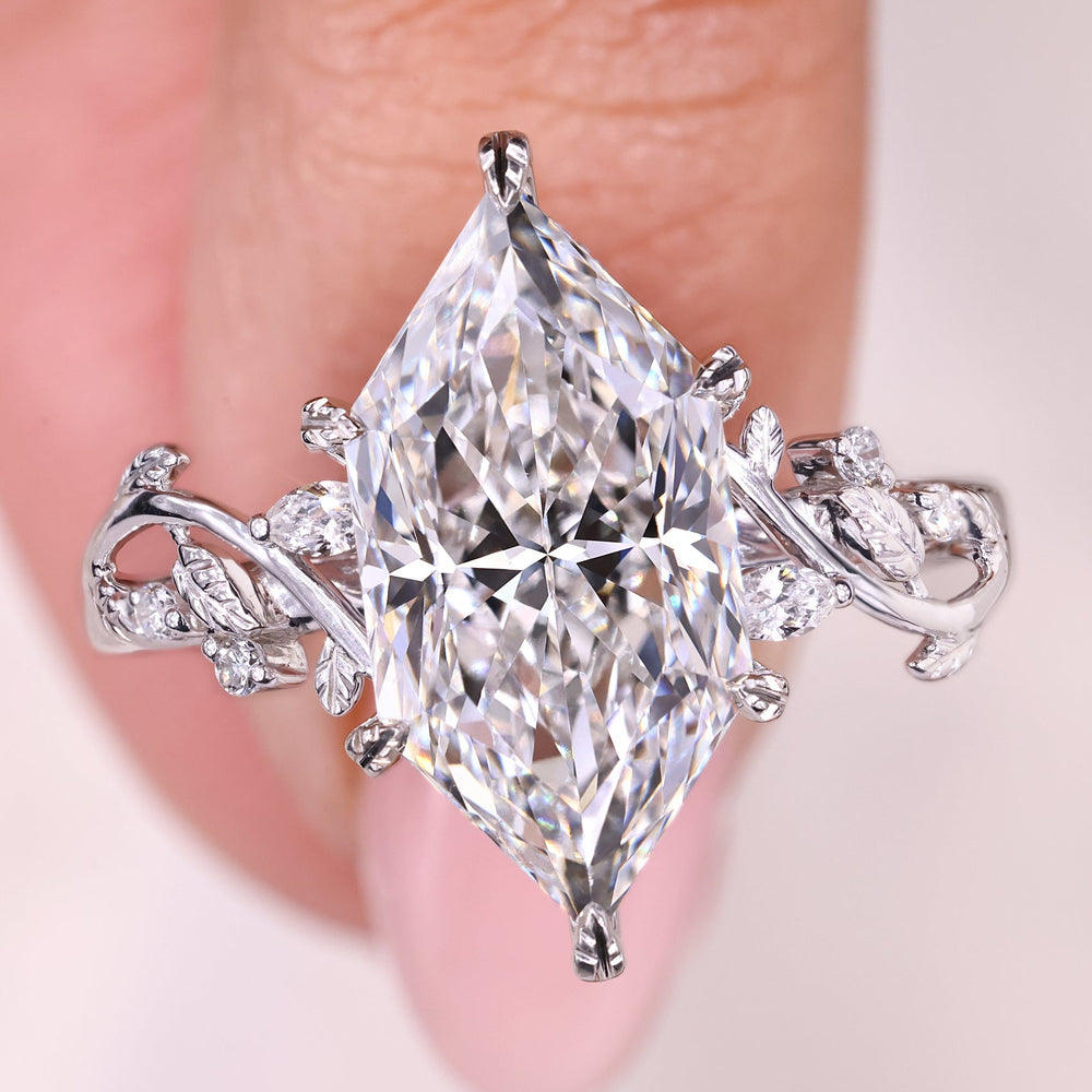 Diamond ring with intricate design on a finger