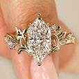 Dutch marquise diamond ring with round side stones.
