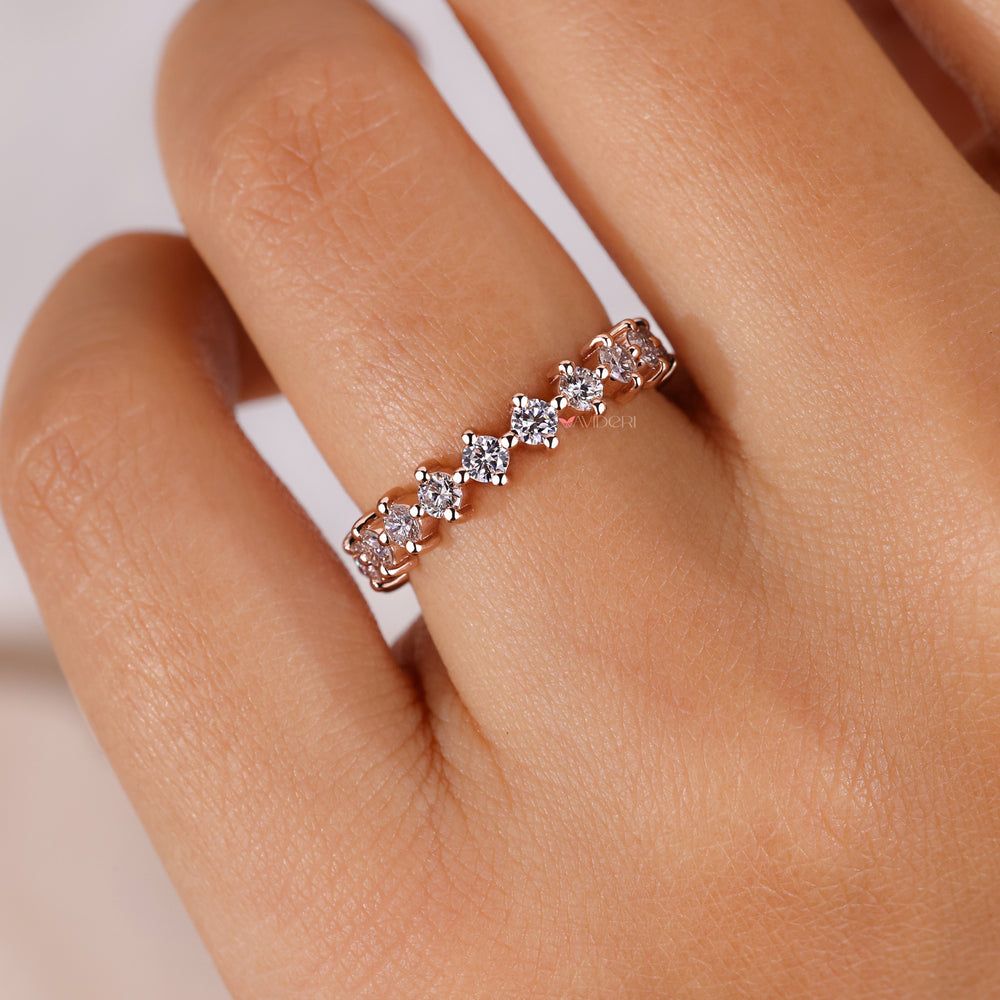 Floating bubble prong band with a playful diamond arrangement.
