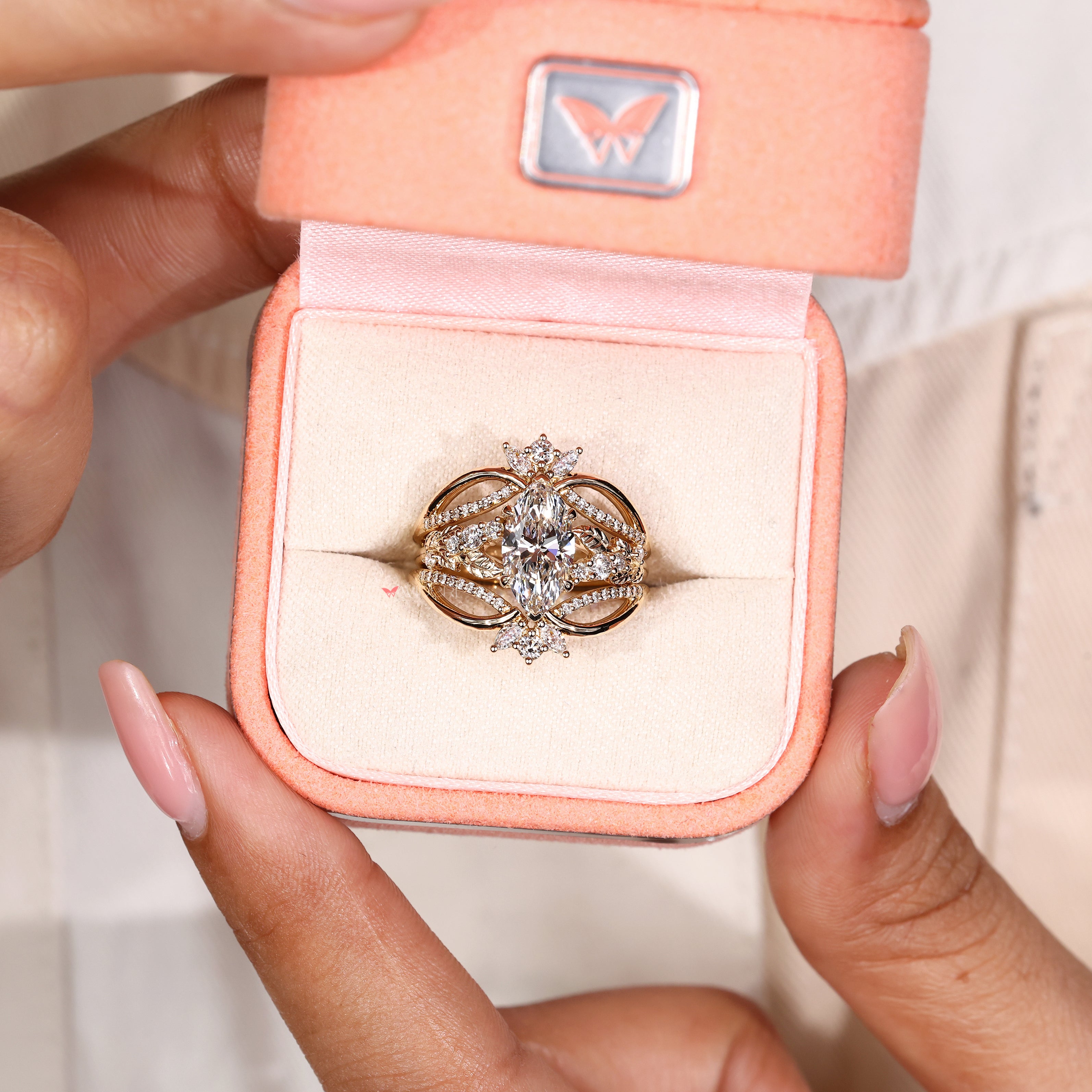 Marquise diamond ring with two V shape prong setting
