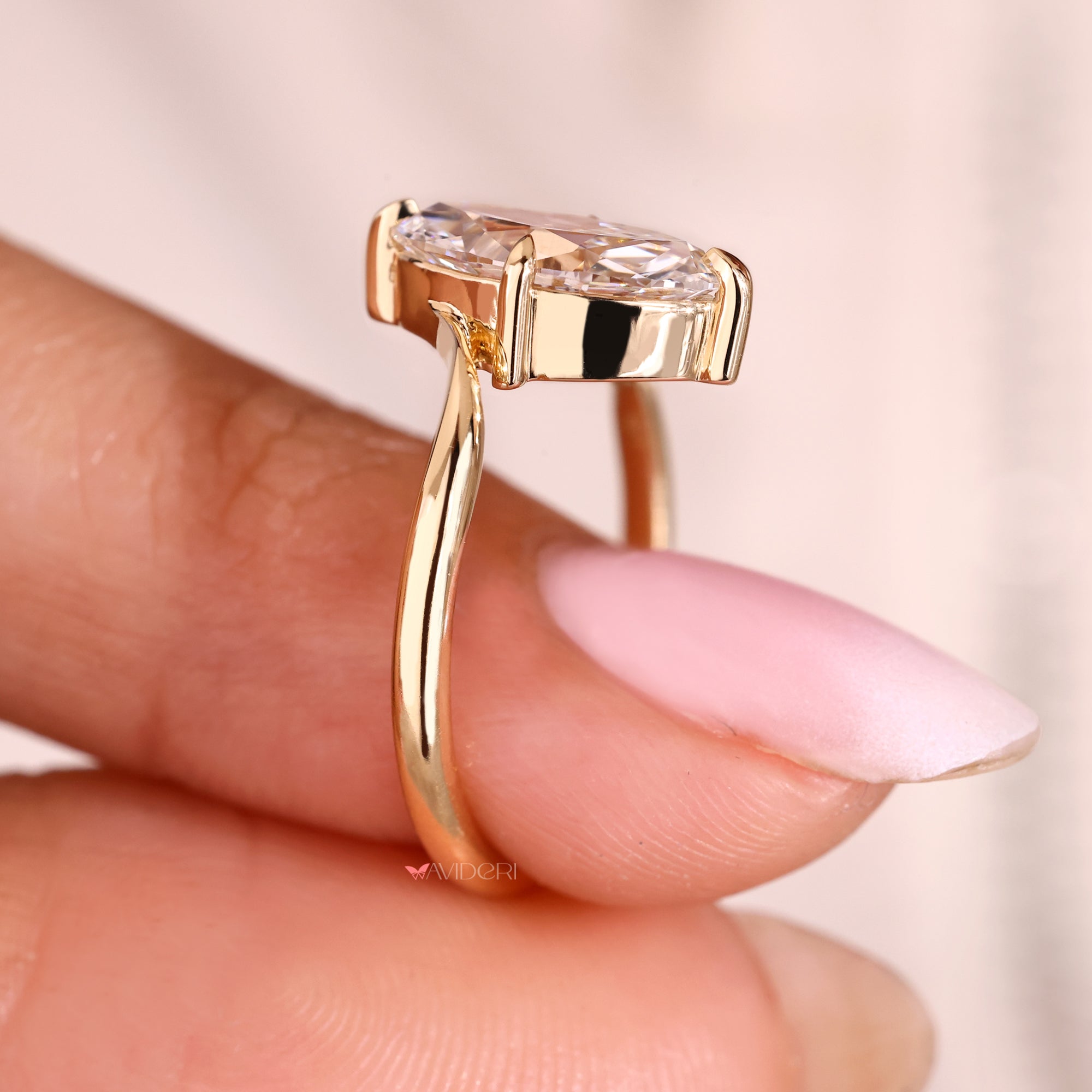 Solitaire ring with compass prong and bypass setting.