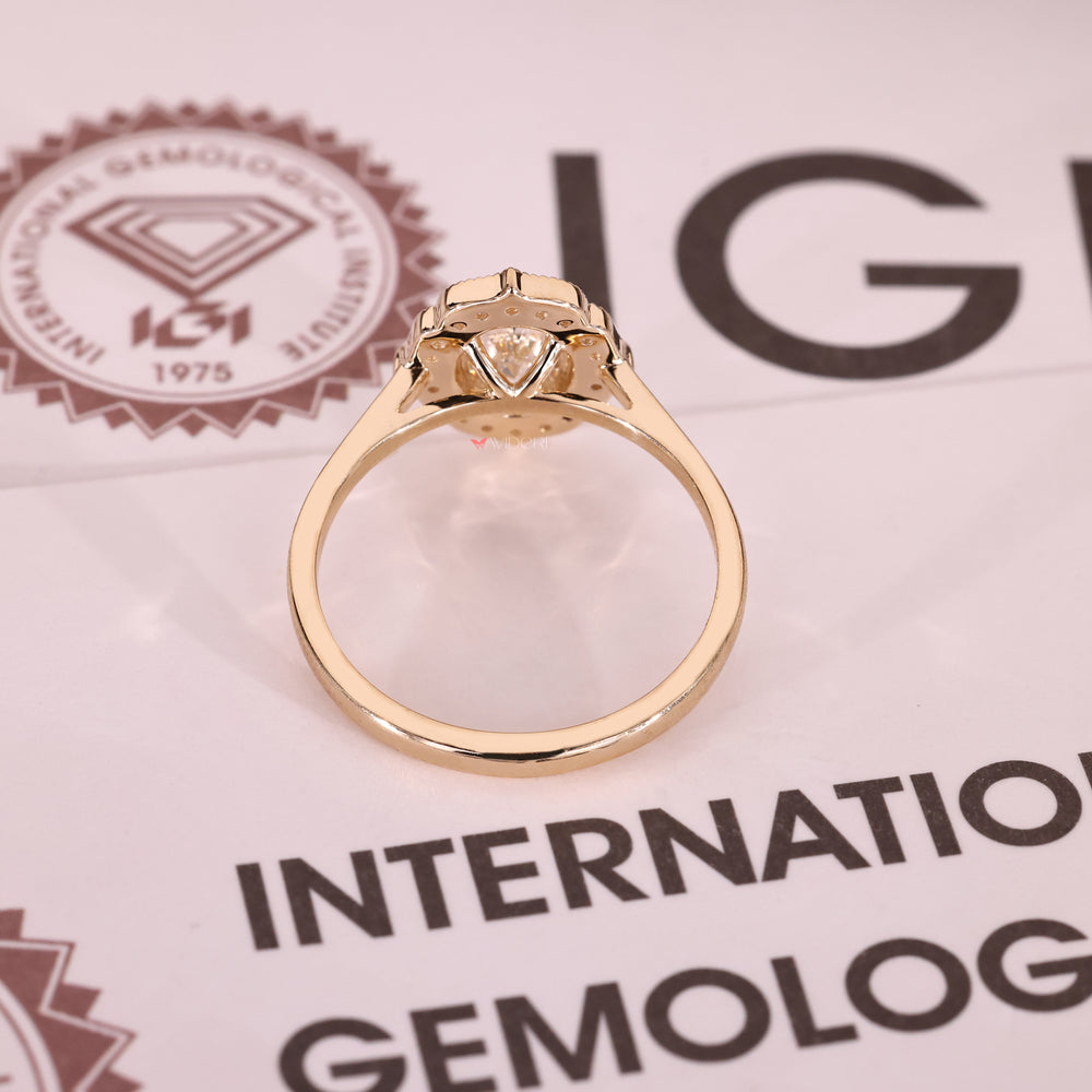 Oval diamond ring with cathedral setting and round halo.