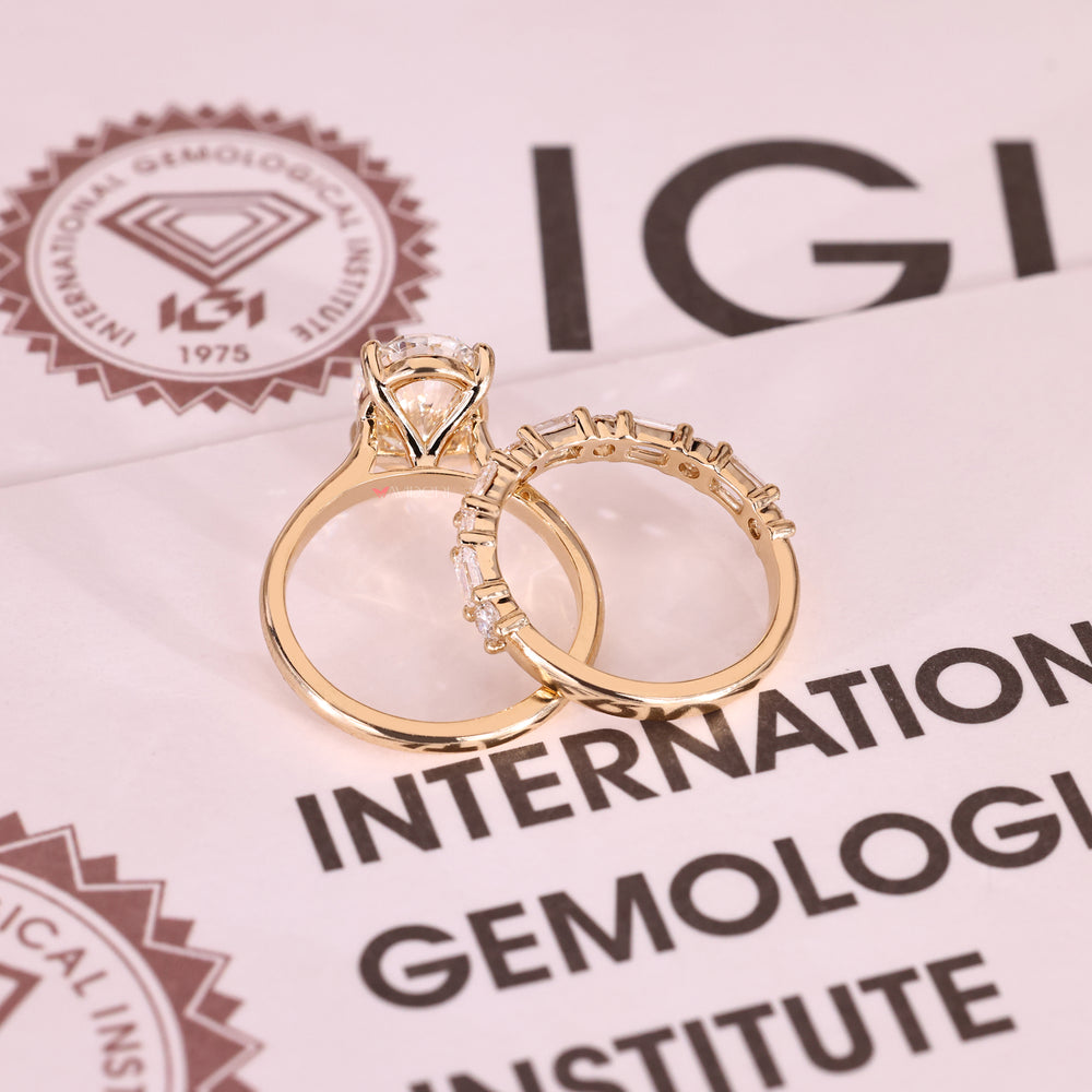 IGI certified oval diamond ring with round and emerald diamonds.