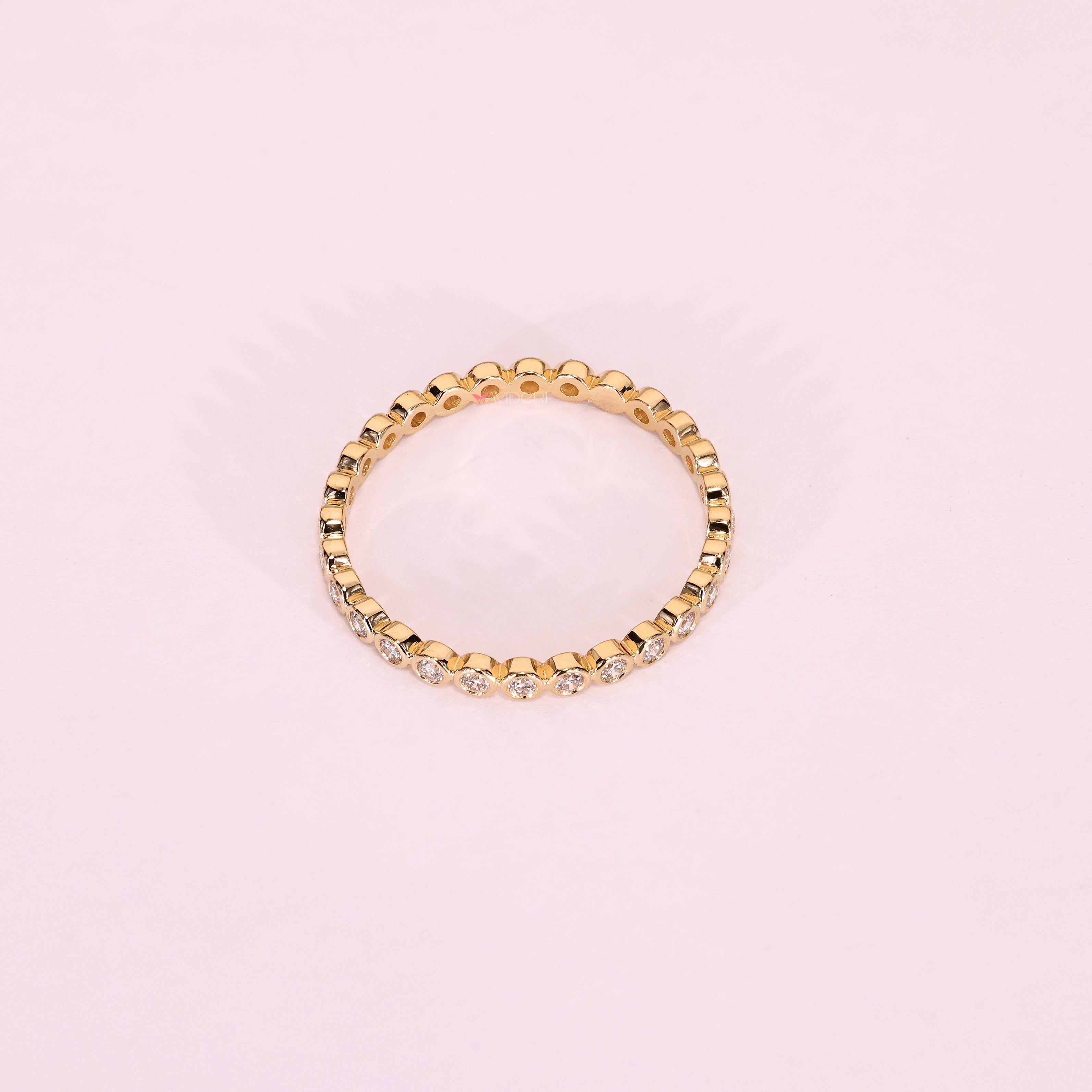 Bezel set round diamond band eternity style.
