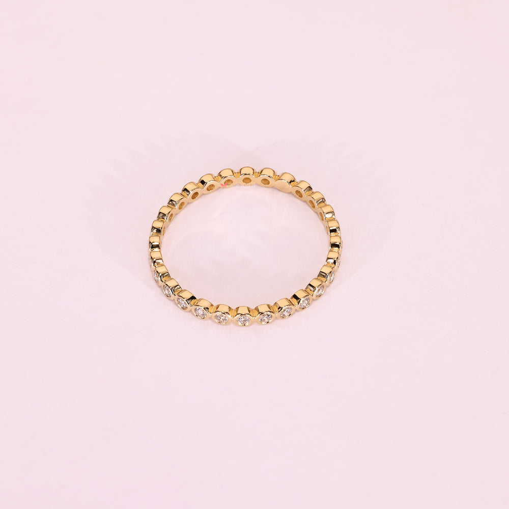 Bezel set round diamond band eternity style.

