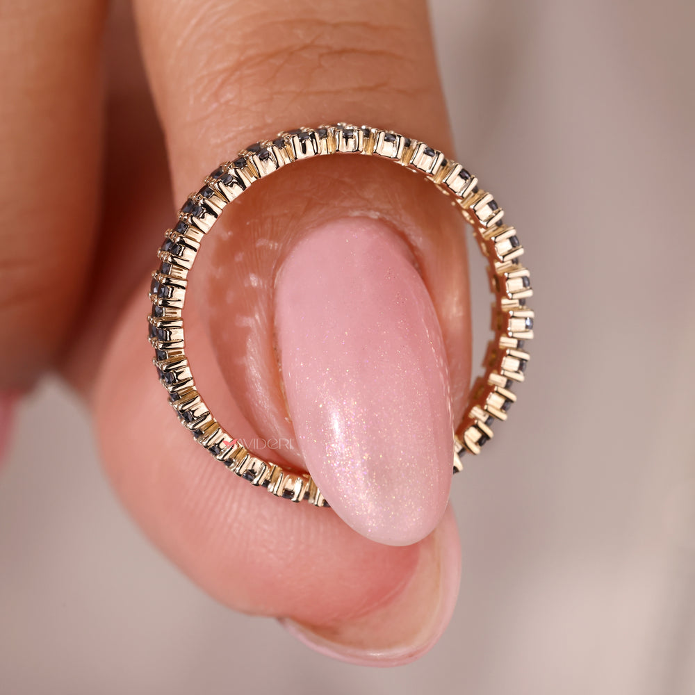 The Moissanite gold wedding band combines warmth with sparkle.