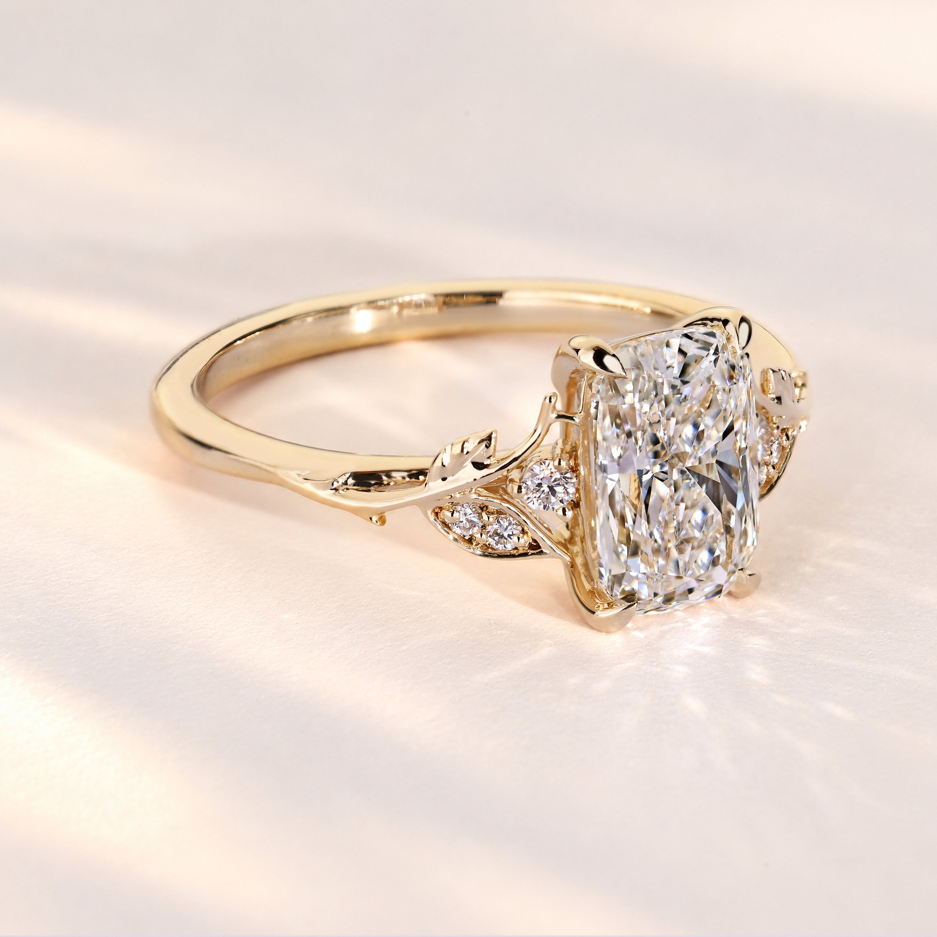 Lab grown cushion diamond ring with claw prongs.
