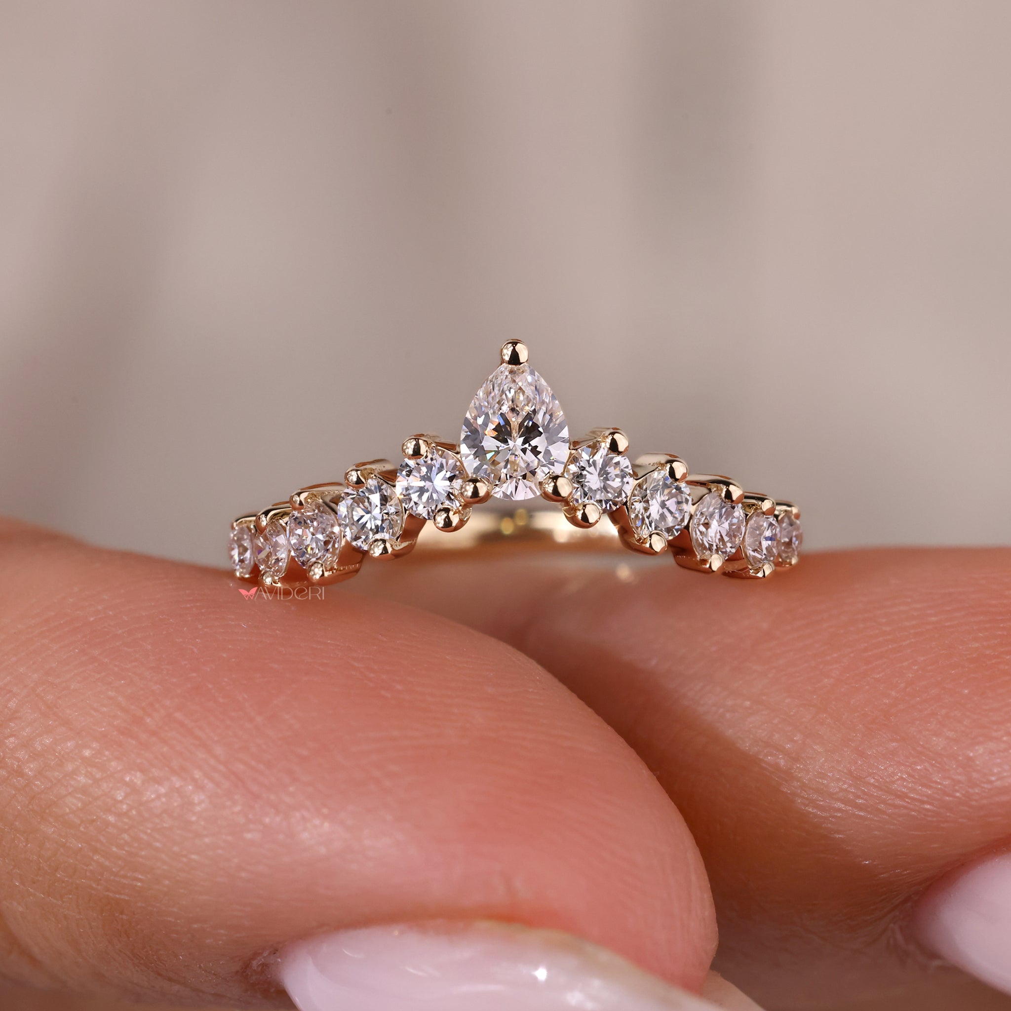 IGI certified pear shaped diamond band for guaranteed quality and sparkle.
