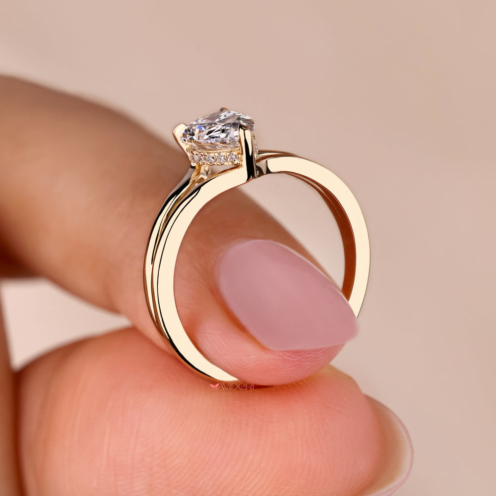 Hidden halo engagement ring featuring a pear shaped engagement ring with hidden halo design for a timeless keepsake.

