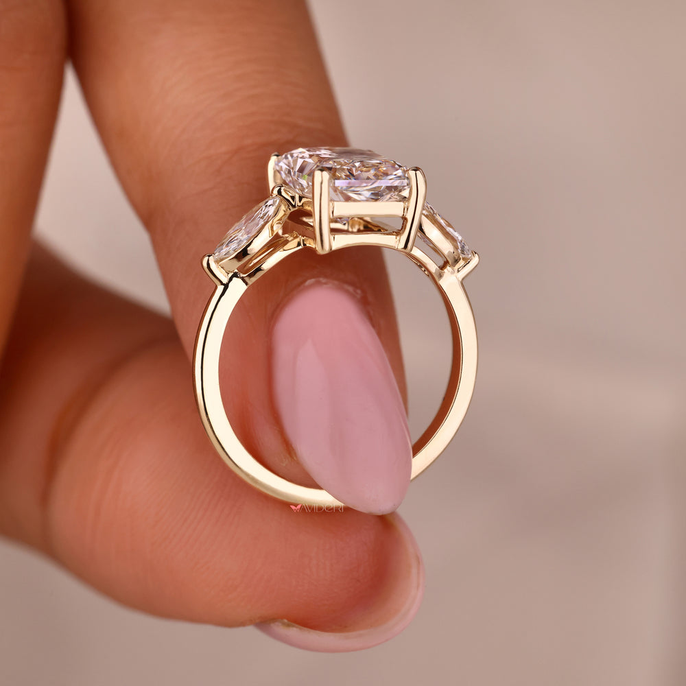 Marquise diamond engagement ring set in yellow gold.
