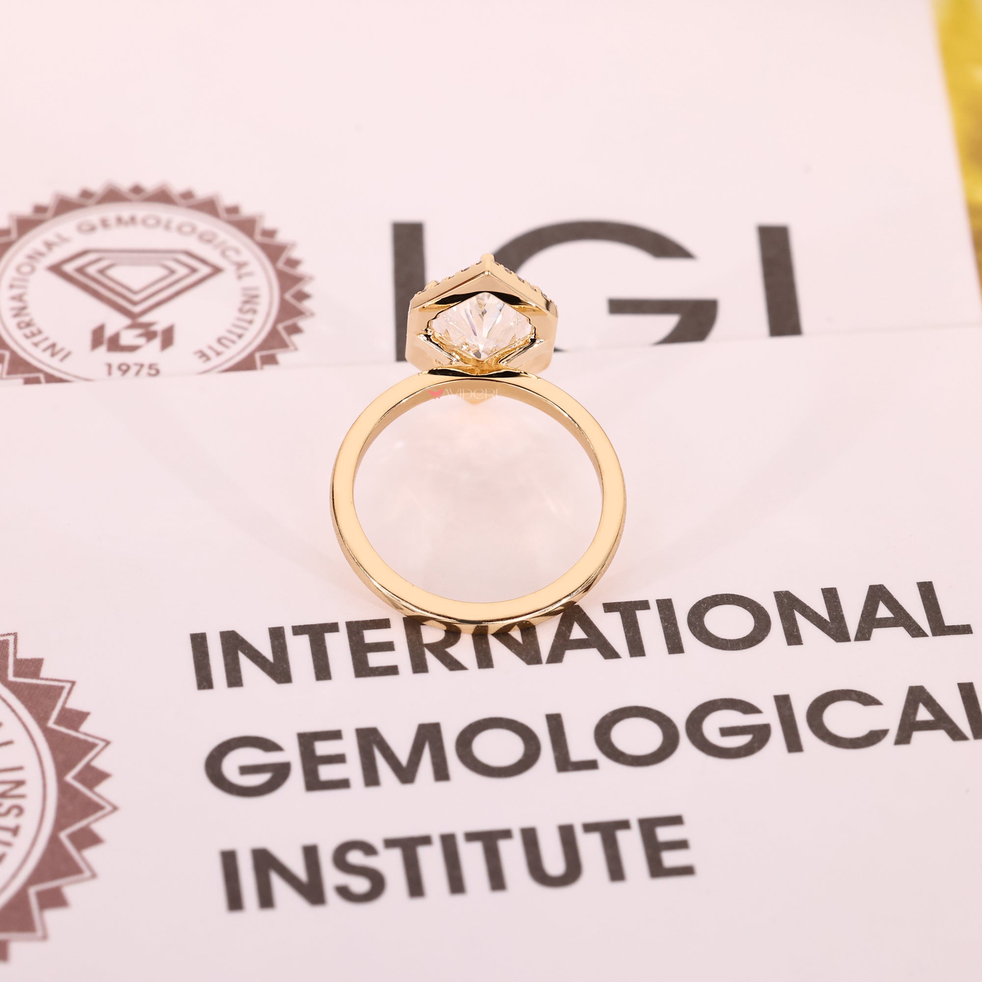 Yellow gold diamond ring with lab-grown diamond ring.