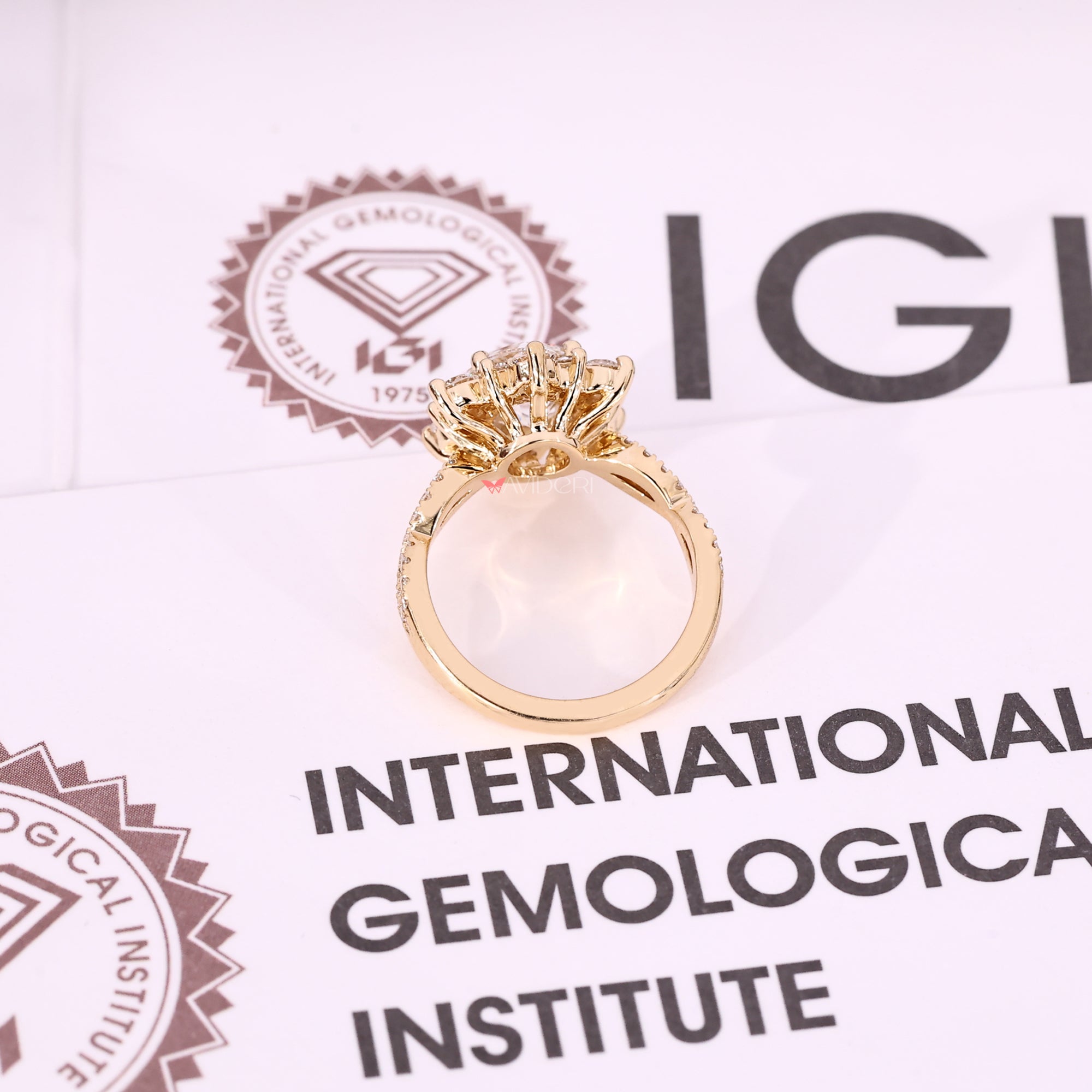 Yellow gold diamond ring with lab-grown diamond ring.