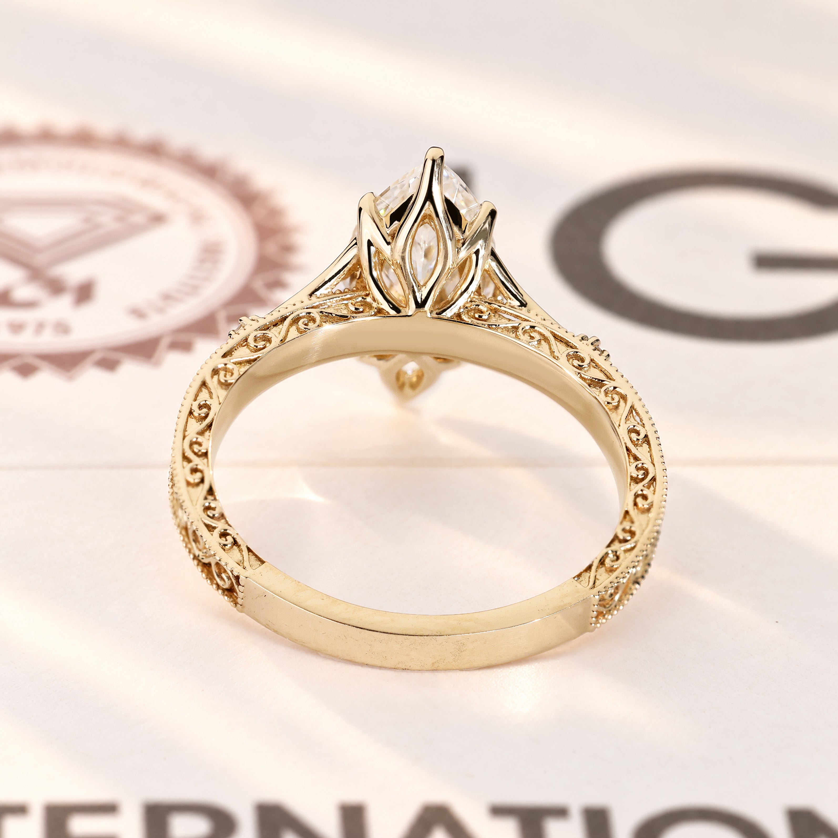 Lab grown marquise diamond ring with side stones.
