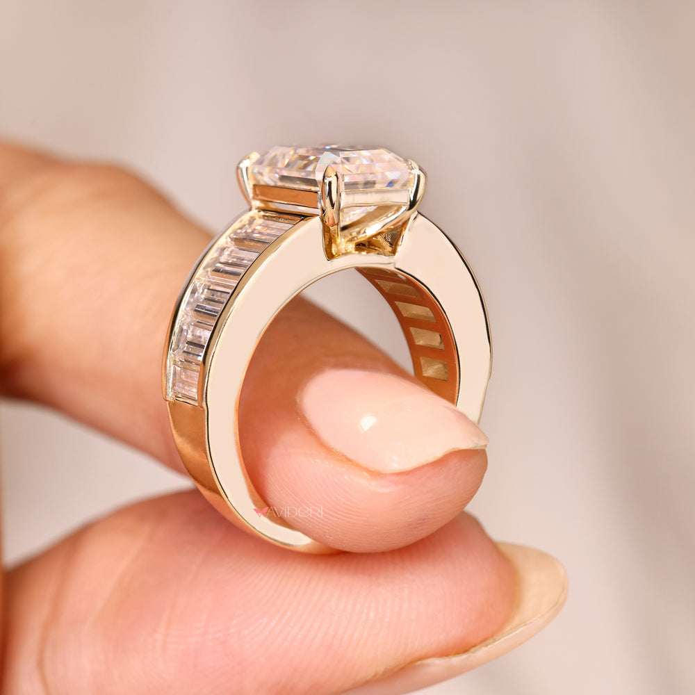 Channel setting emerald diamond ring design.
