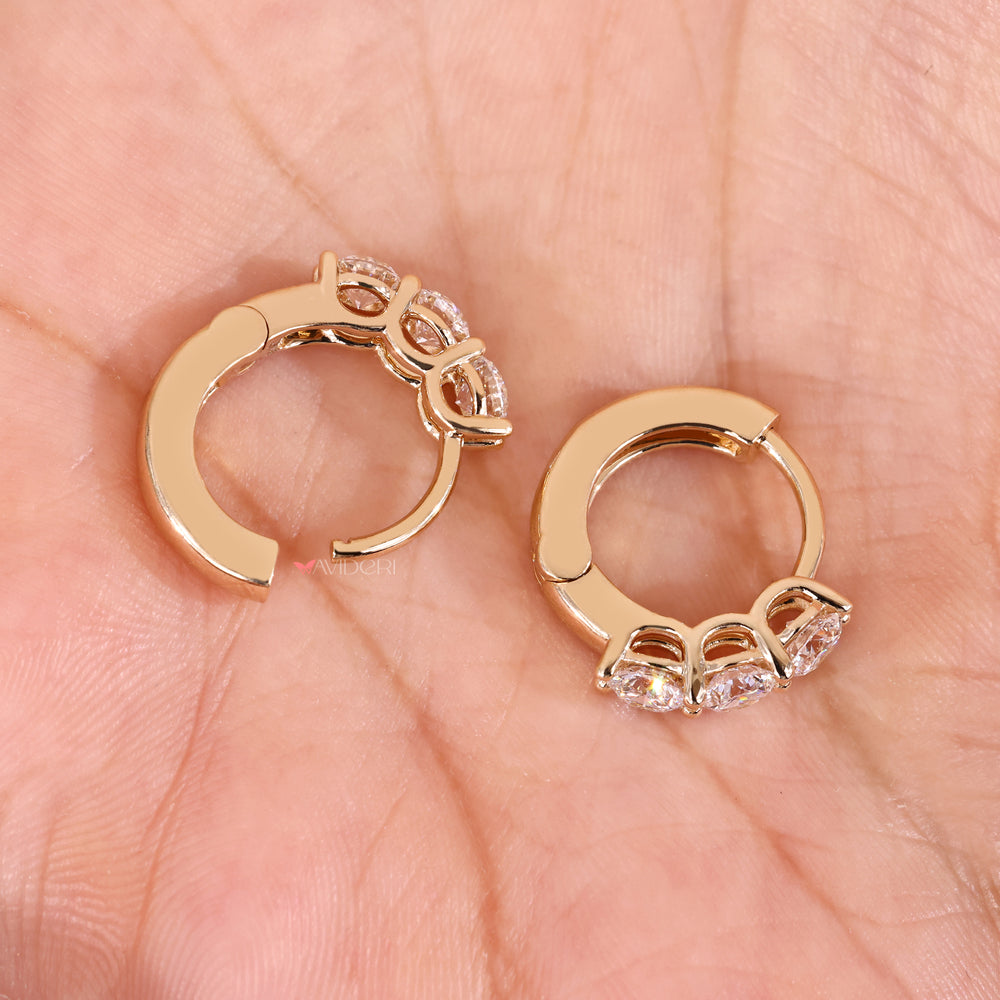 Yellow gold earrings with lab grown diamond earrings.