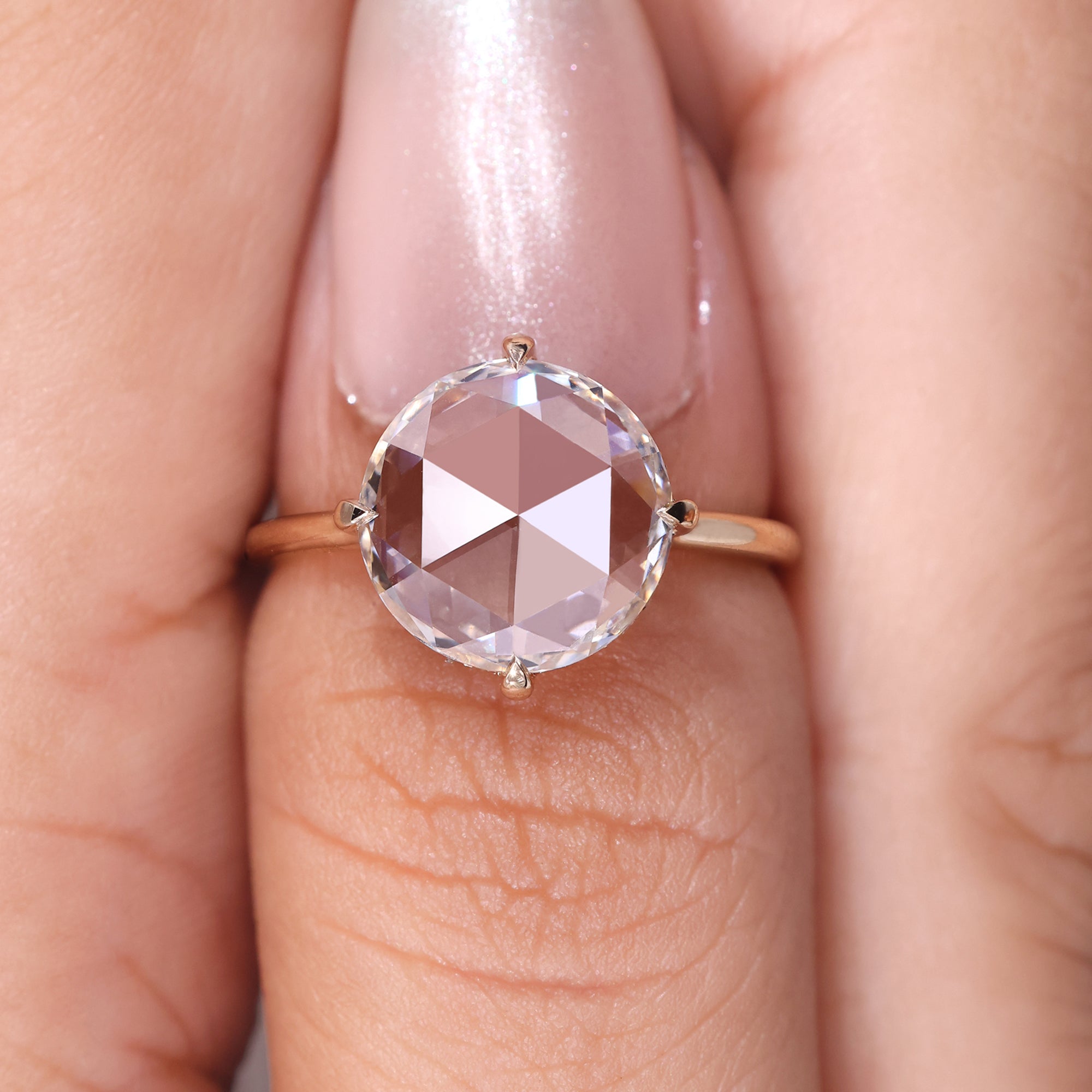 Round rose diamond engagement ring set in yellow gold, offering a warm and unique design.
