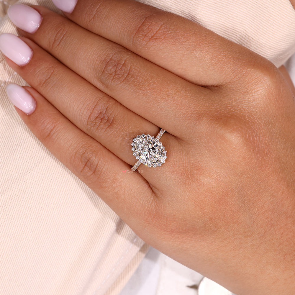Halo ring featuring an oval diamond for a sparkling and classic design.
