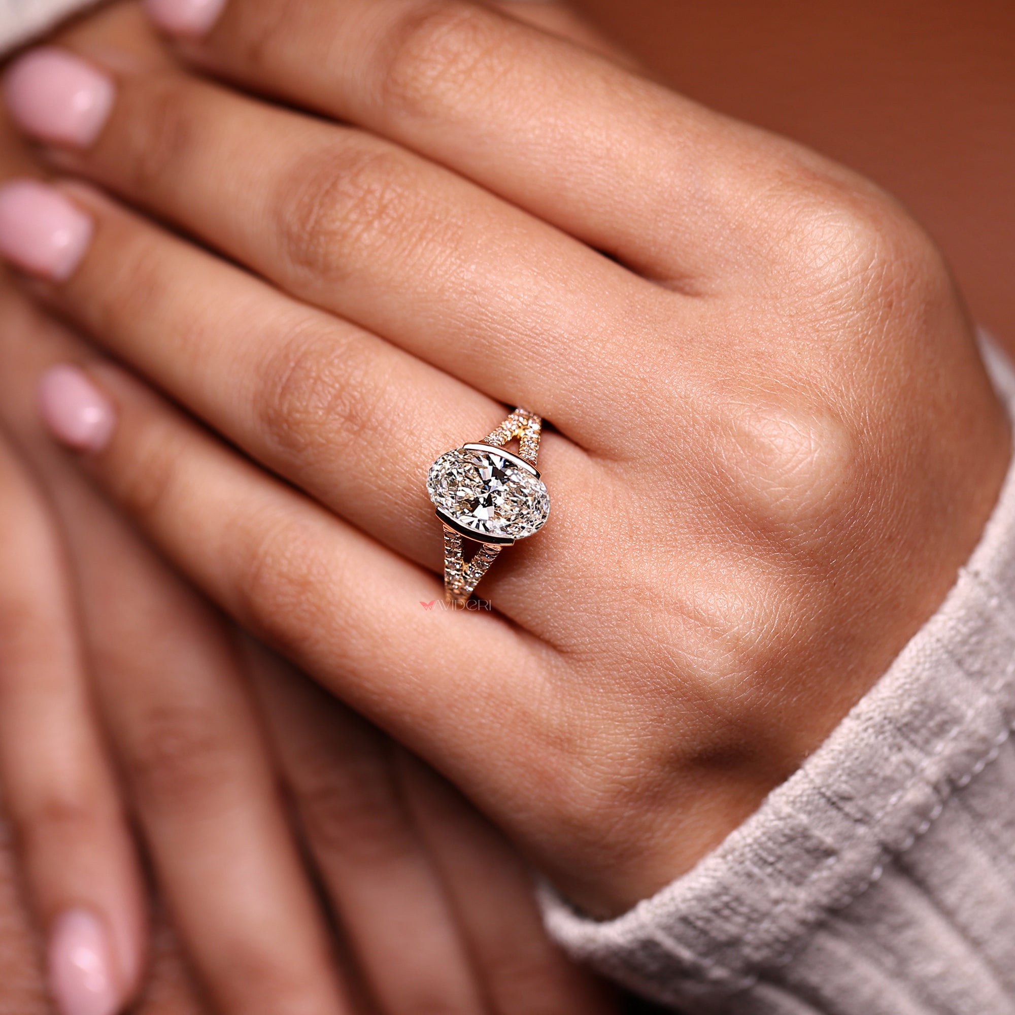 Split shank ring with yellow gold engagement ring.