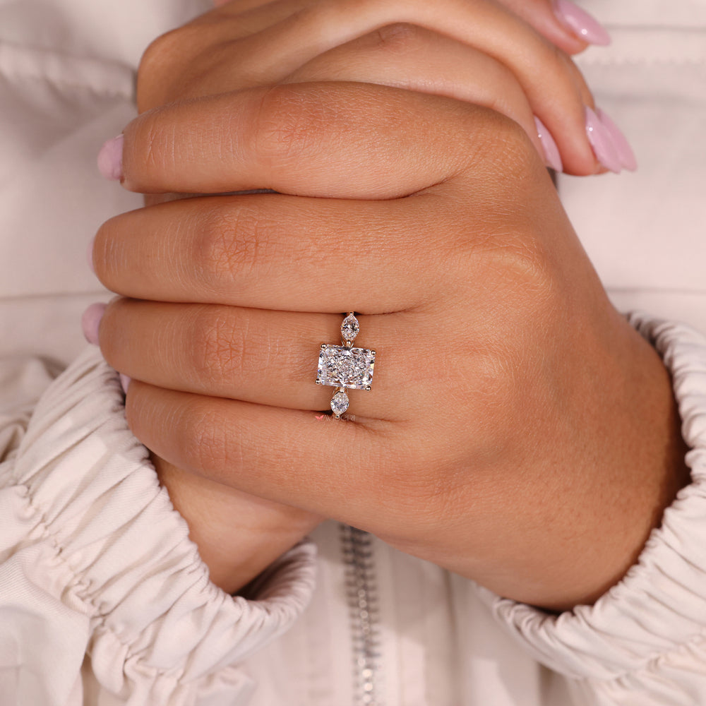 Three stone ring crafted in IGI certified yellow gold setting.
