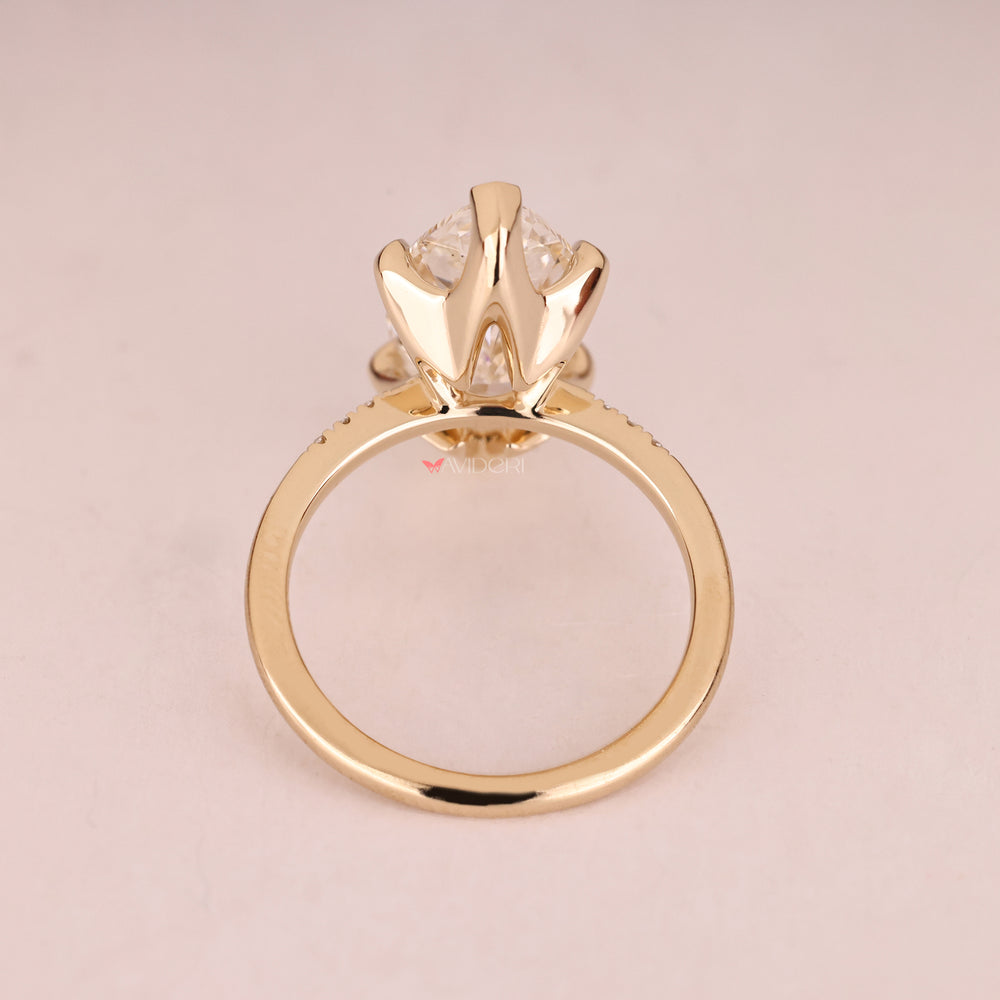Yellow gold diamond ring for her with elegant marquise cut.