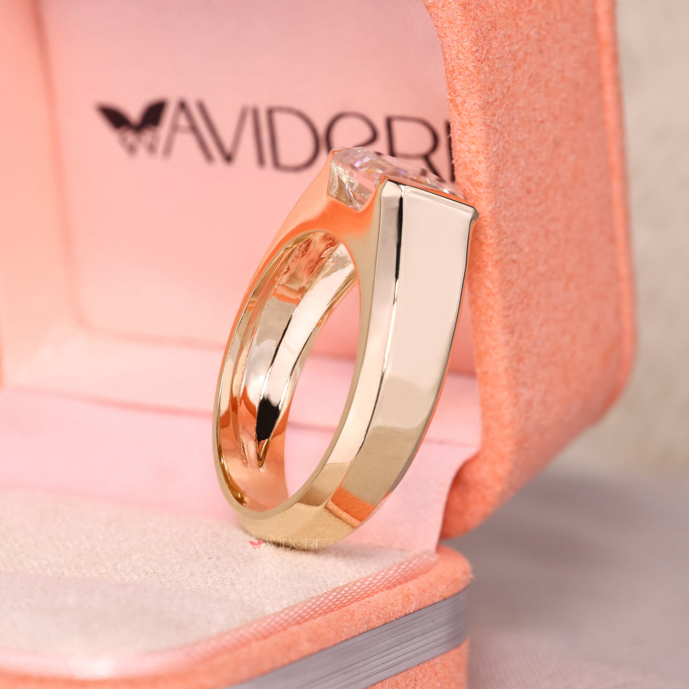 Emerald cut men's ring with bezel setting.
