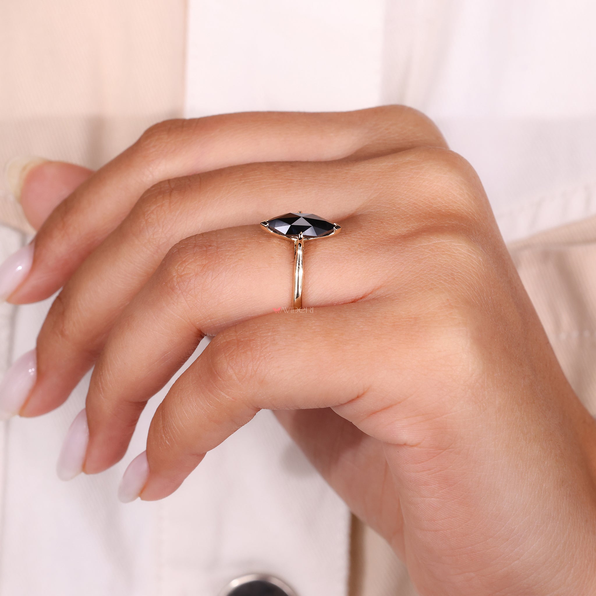 A timeless solitaire ring with a handcrafted moissanite stone.
