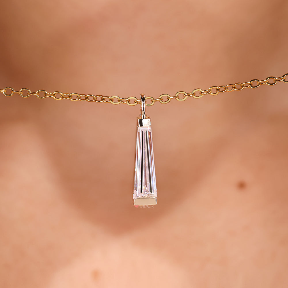 Tapered baguette moissanite pendant in handmade solitaire style.
