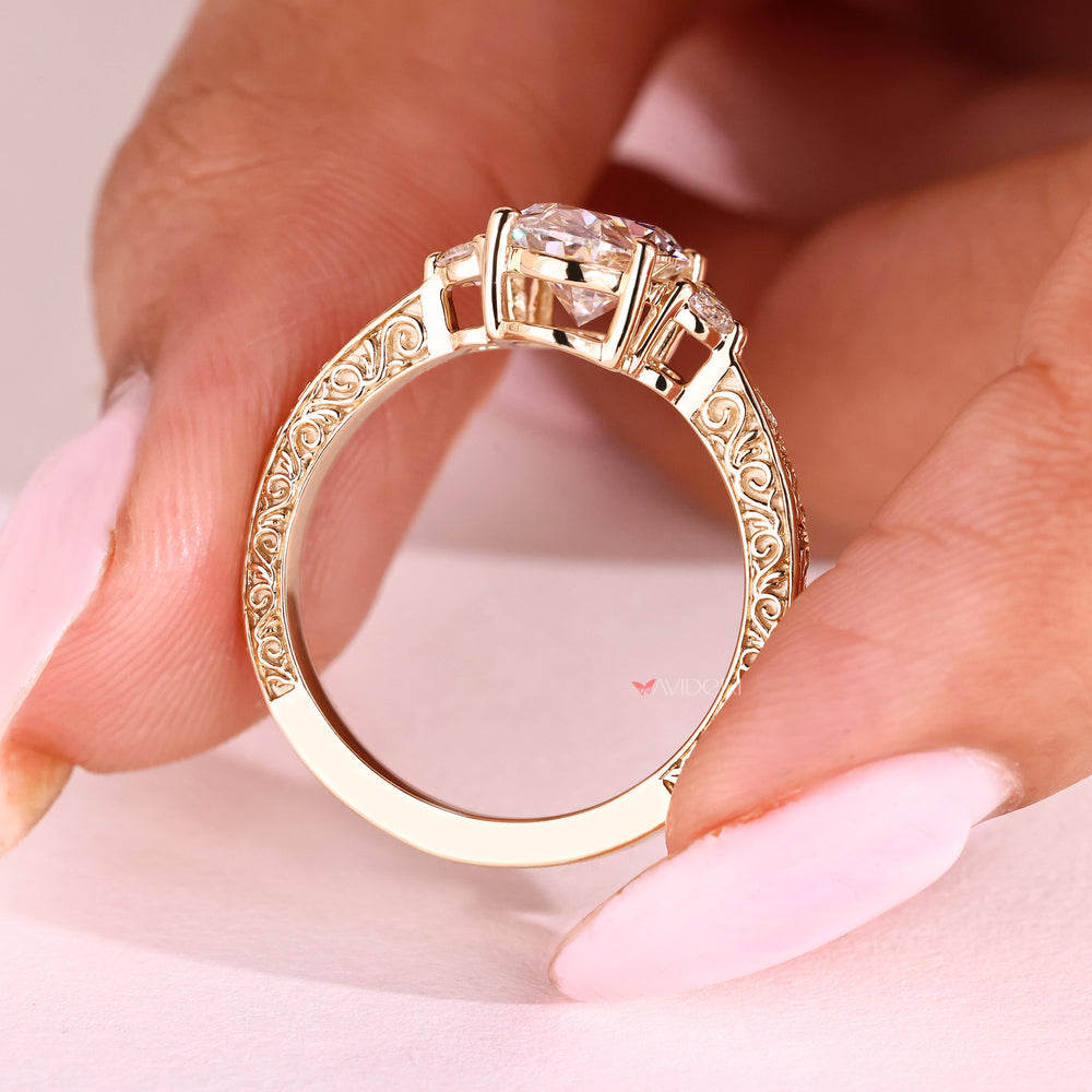 Oval cut diamond ring with round side stones design
