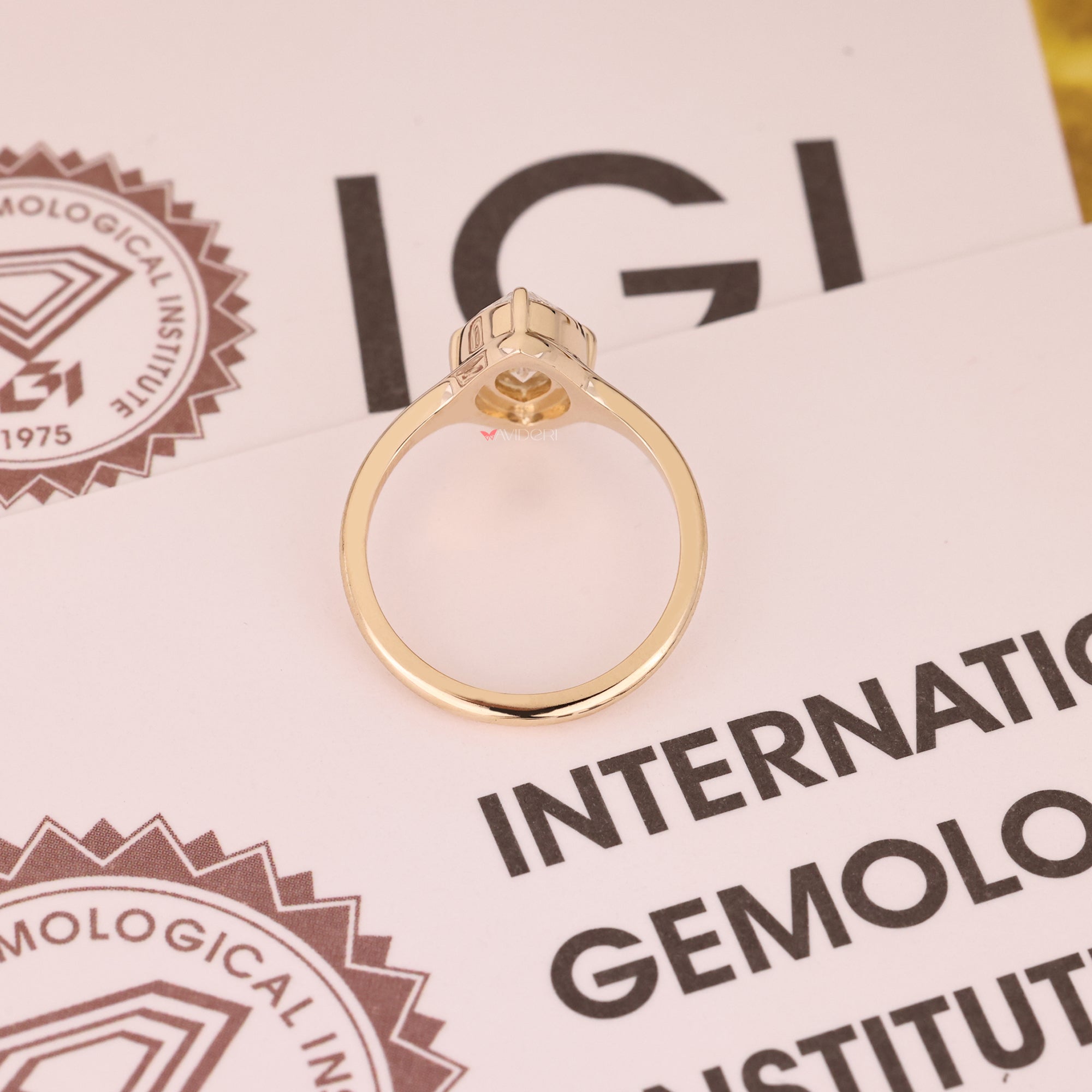 IGI certified stone in yellow gold engagement ring.