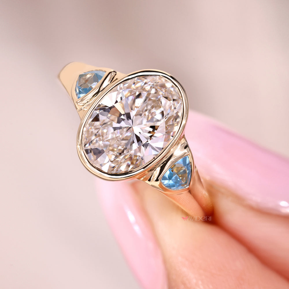 Custom diamond ring with oval and trillion stones.