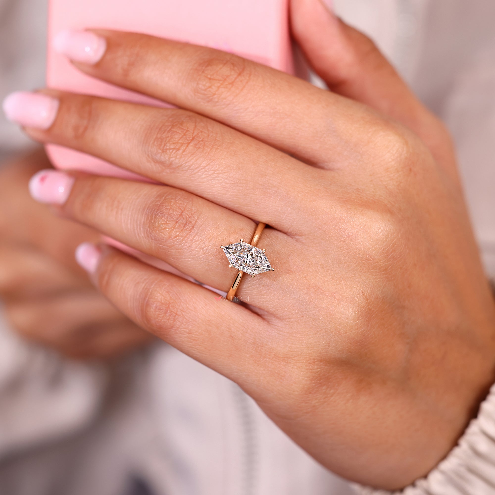 Dutch marquise ring with round diamond hidden halo.
