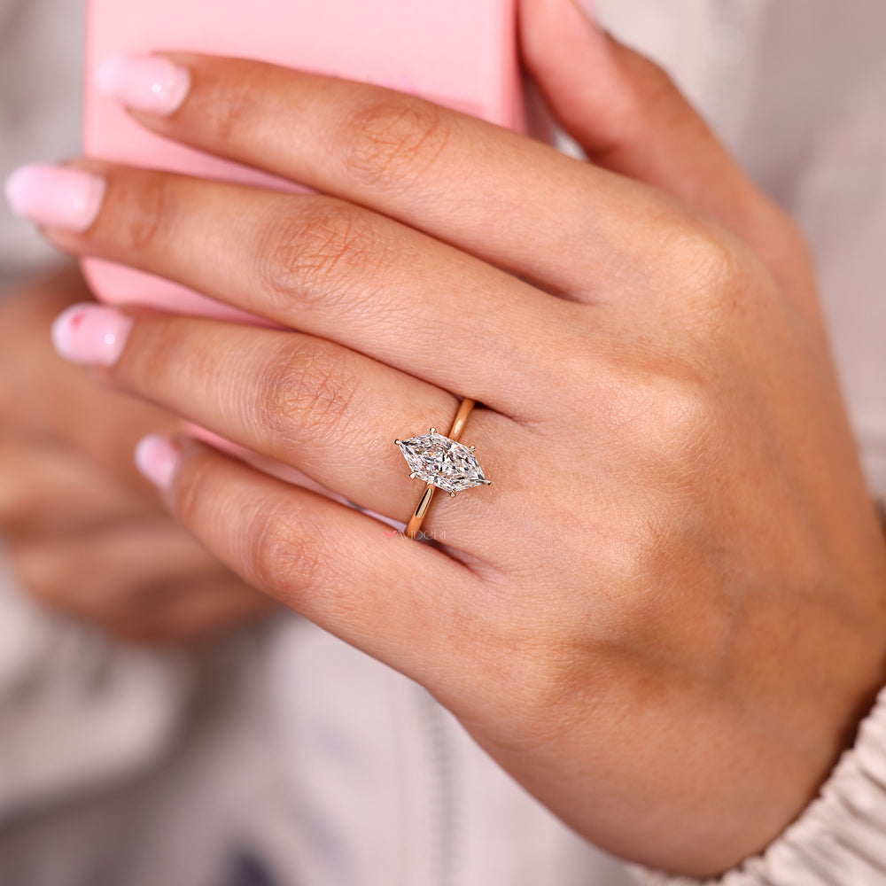 Dutch marquise ring with round diamond hidden halo.
