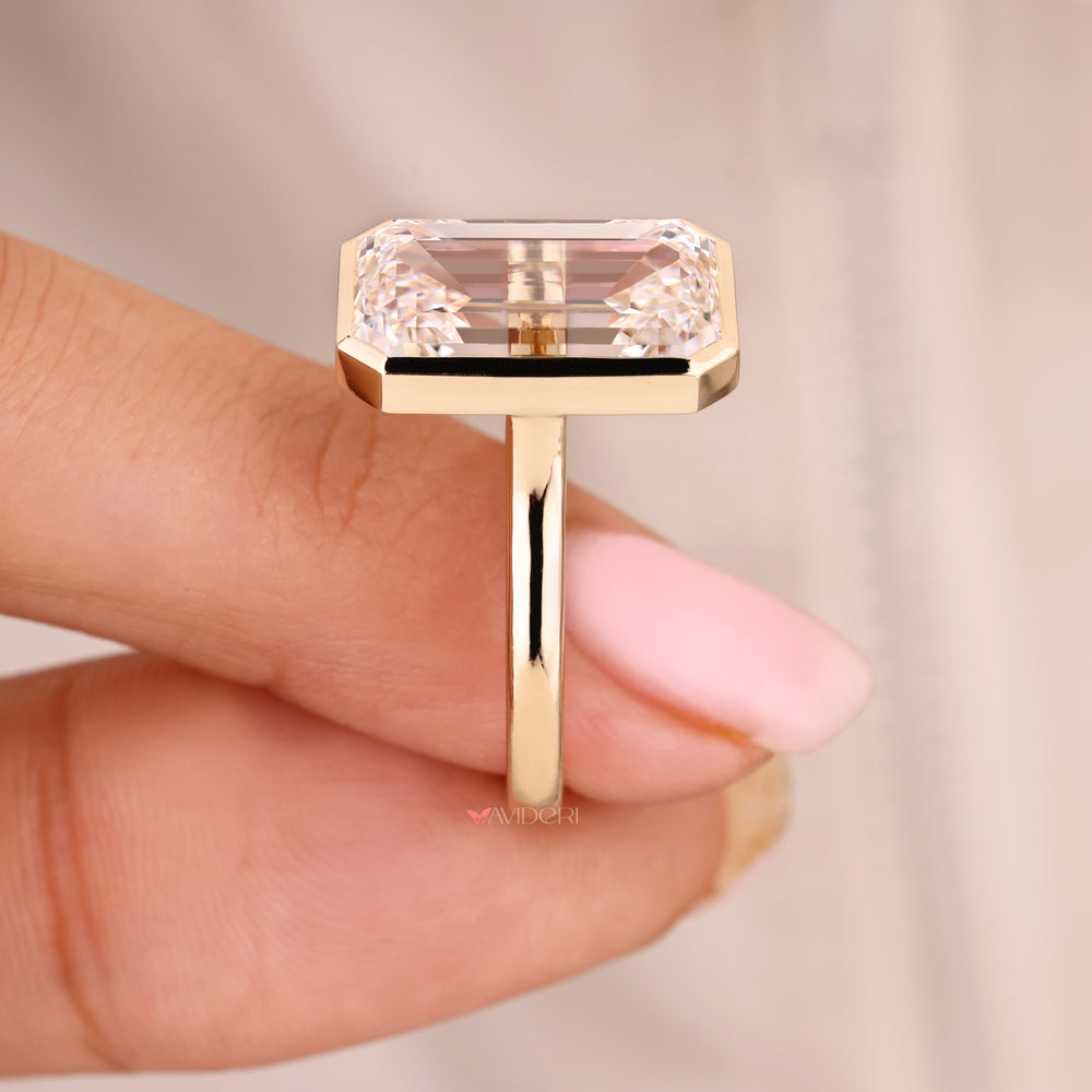 Yellow Gold Emerald Cut Bezel Set Engagement Ring.