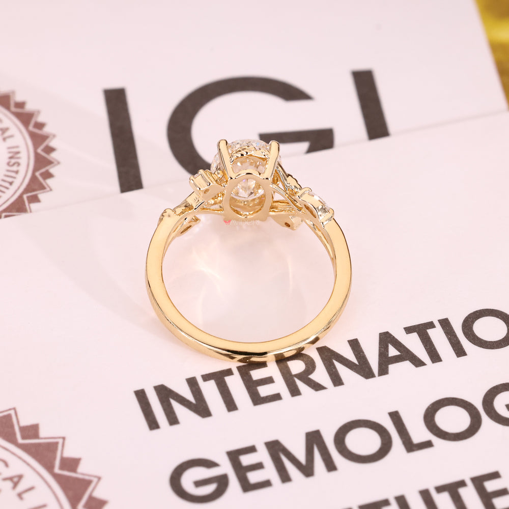 Yellow Gold Oval Cut Diamond Ring with Four Prongs.