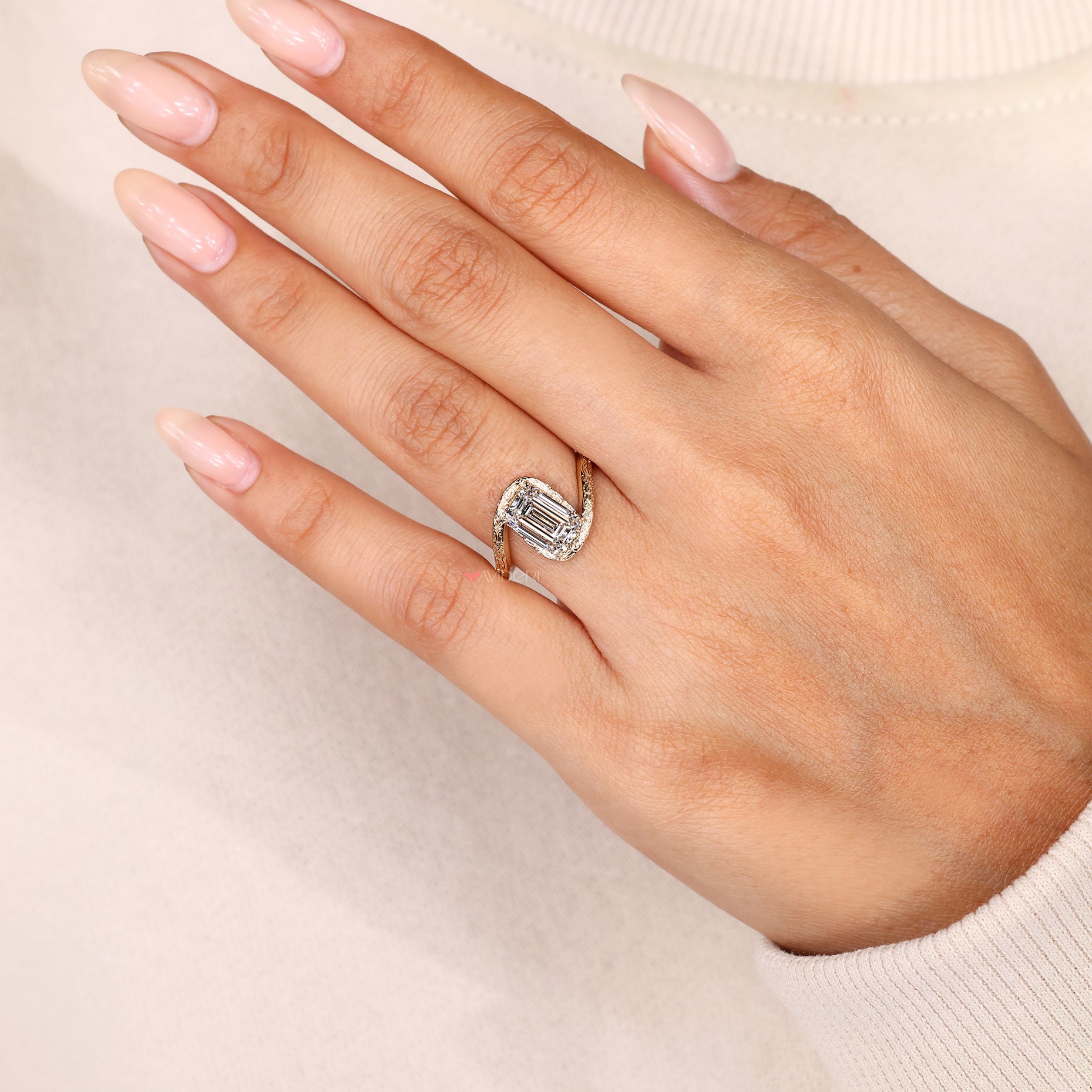 IGI certified emerald cut lab grown diamond ring.
