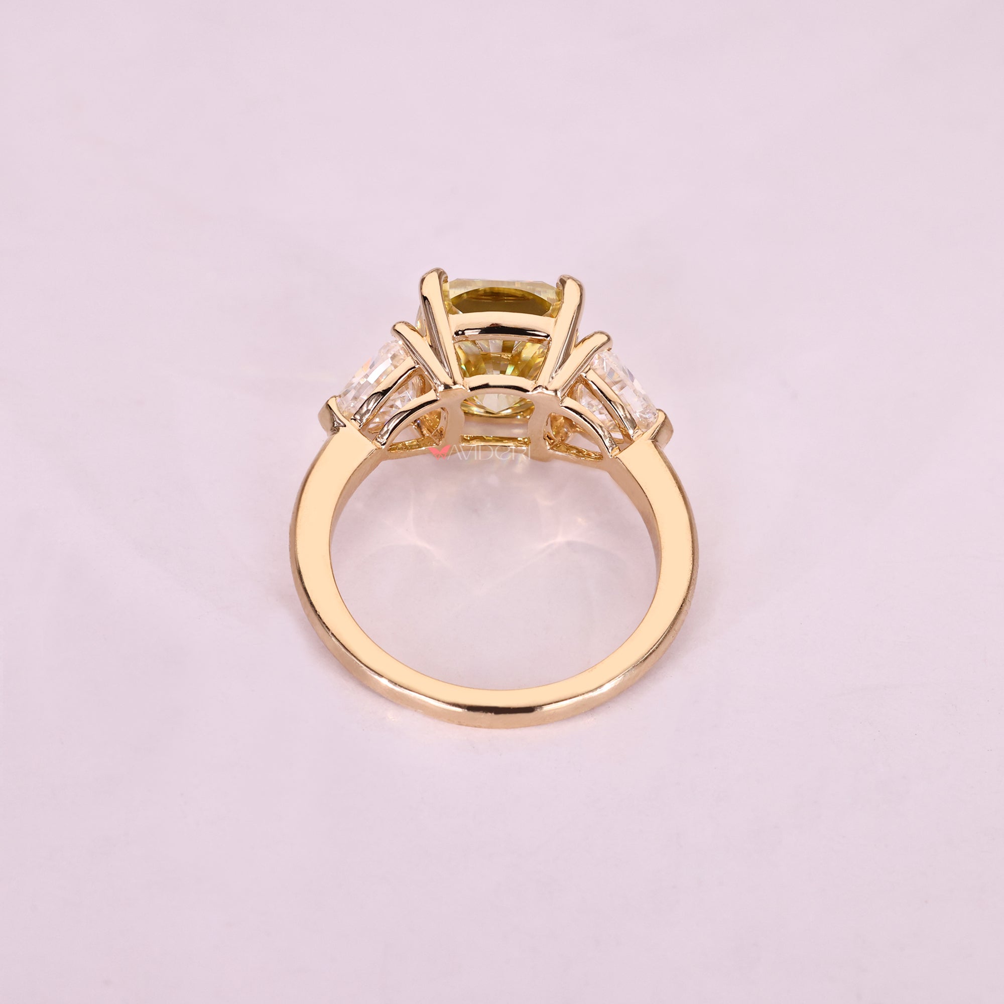 Handmade three stone moissanite ring with v prong setting.
