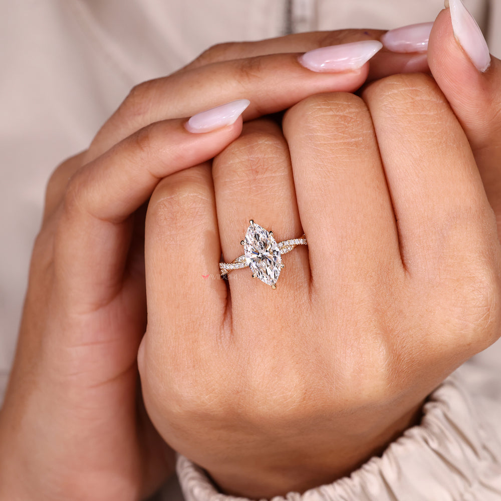 Avideri marquise cut diamond ring with twisted pave band.
