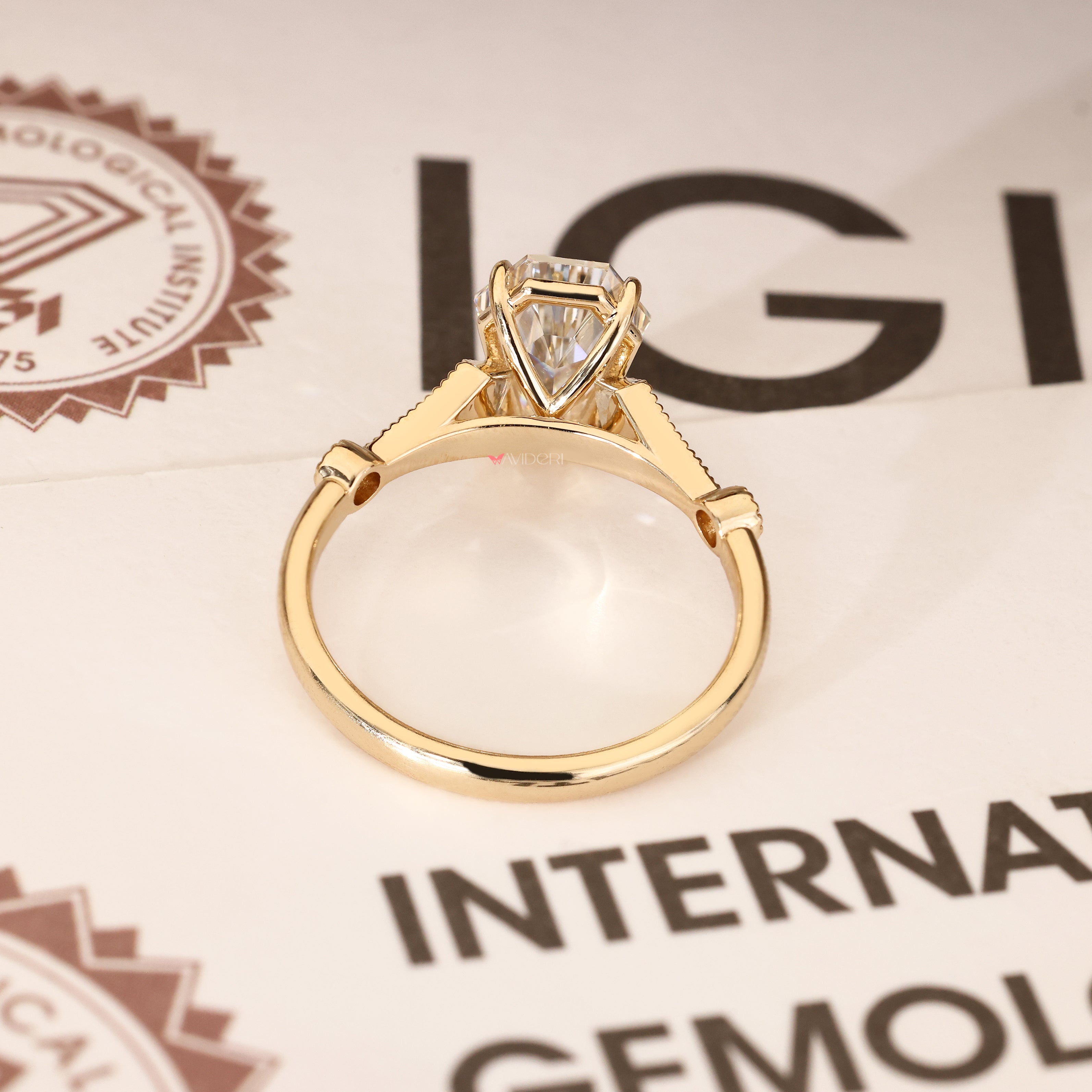 IGI certified coffin cut ring with four claw prongs
