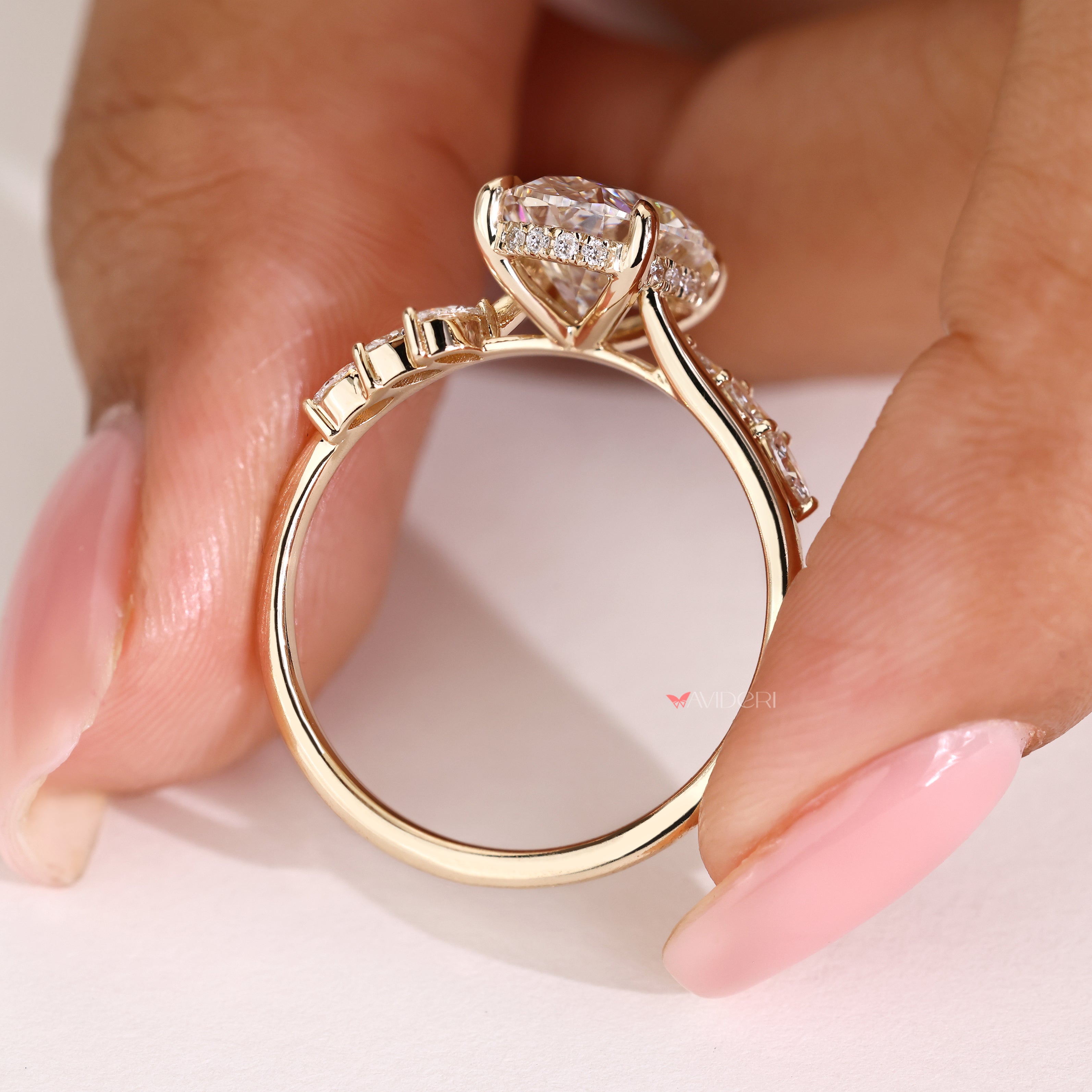 Avideri oval diamond ring with marquise and round stones

