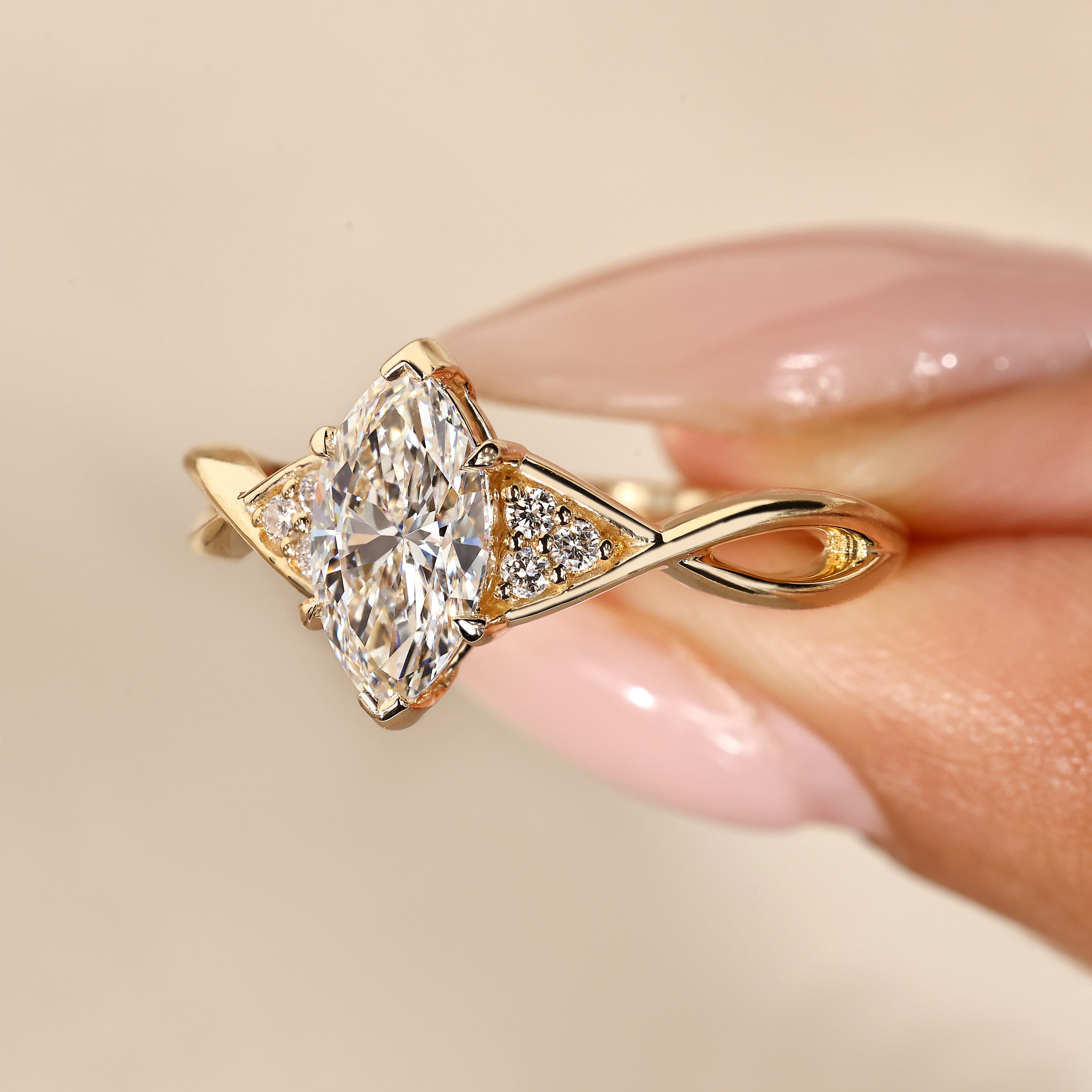 Marquise ring with muse setting and tapered shank.
