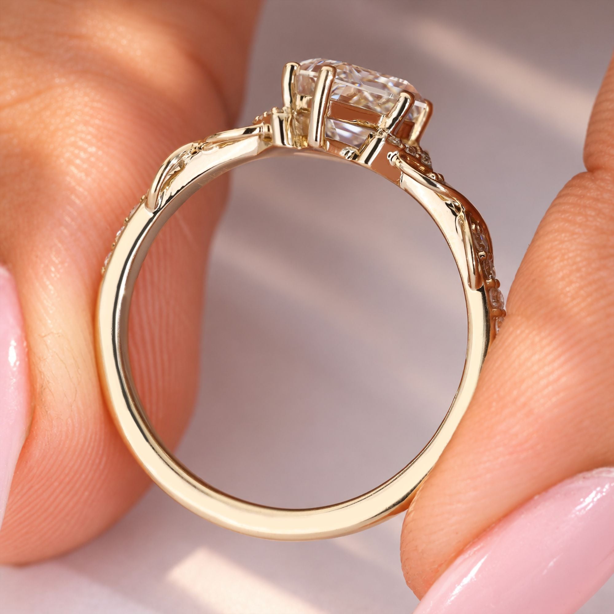 Nature inspired kite diamond ring with twisted vine.
