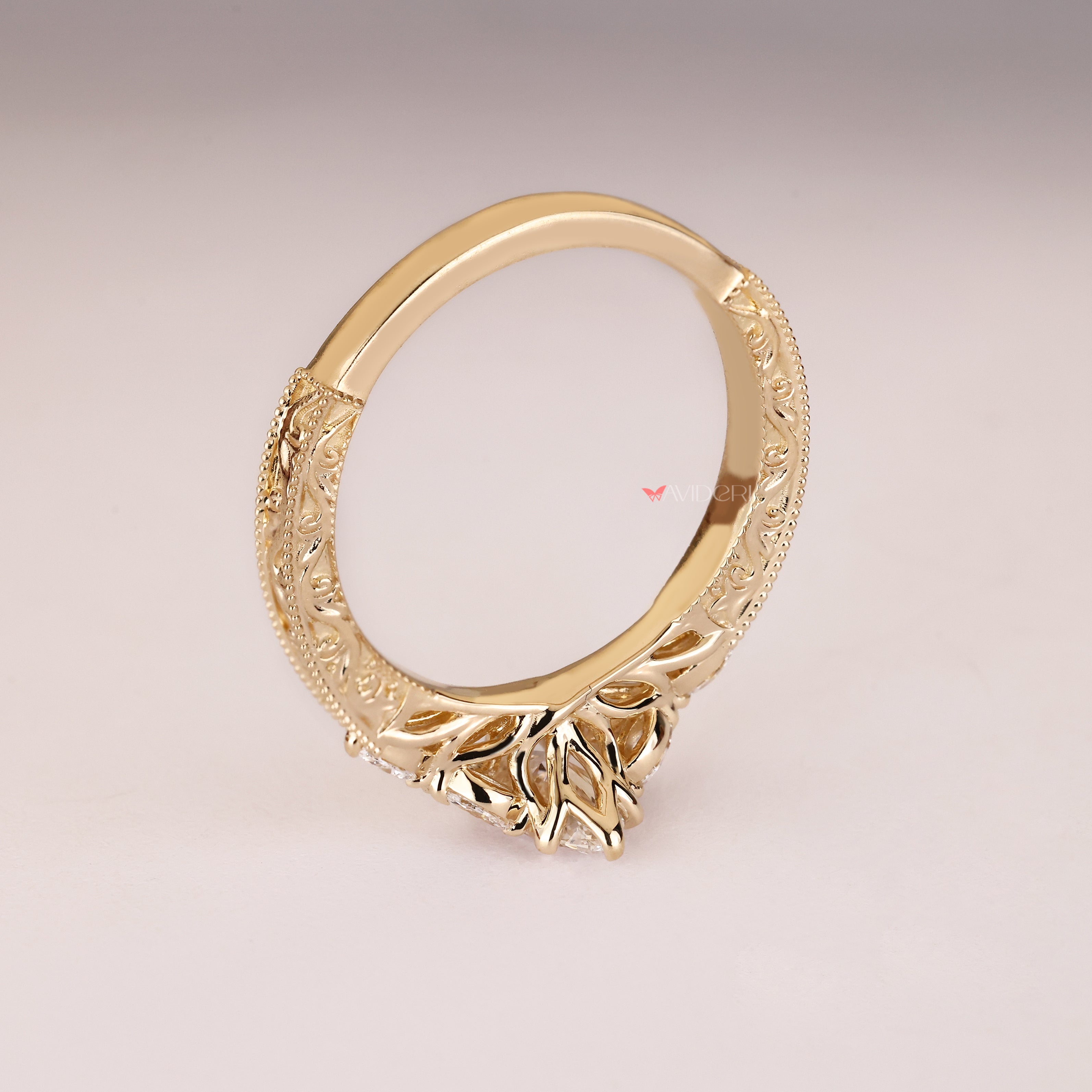 Marquise ring with engraved shank and milgrain.
