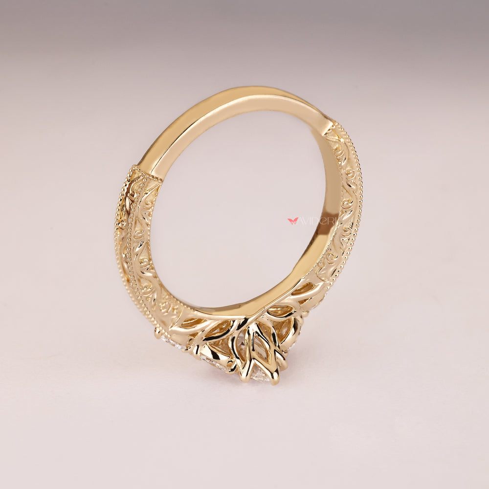 Marquise ring with engraved shank and milgrain.
