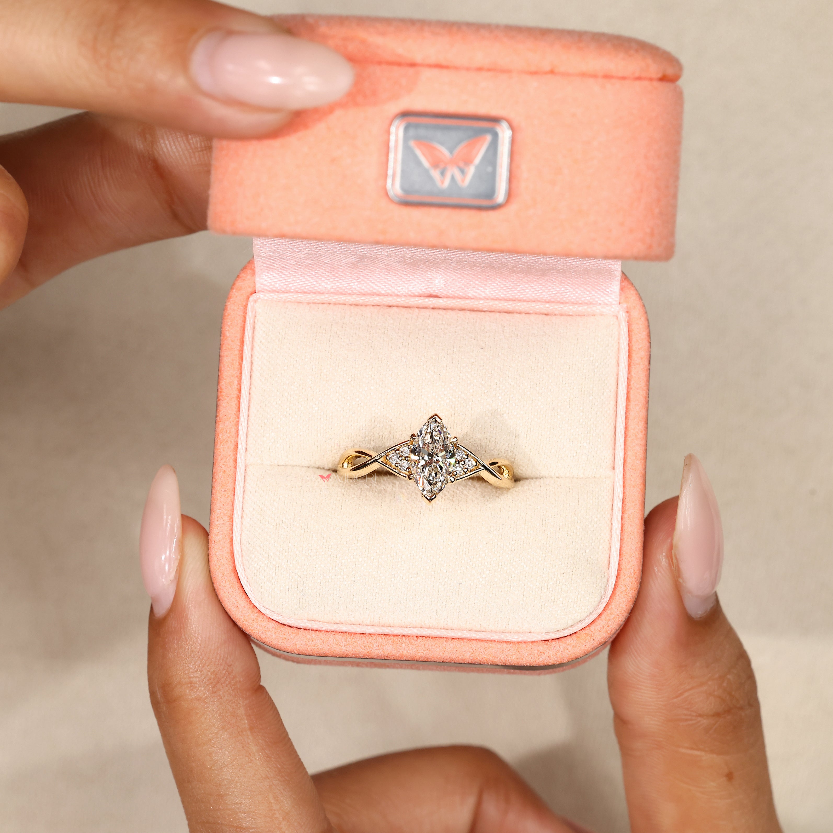 Marquise diamond ring with V shaped prongs.
