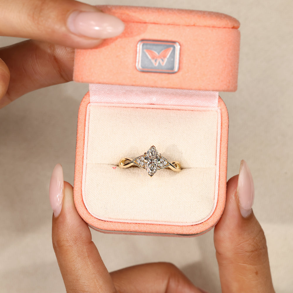 Marquise diamond ring with V shaped prongs.
