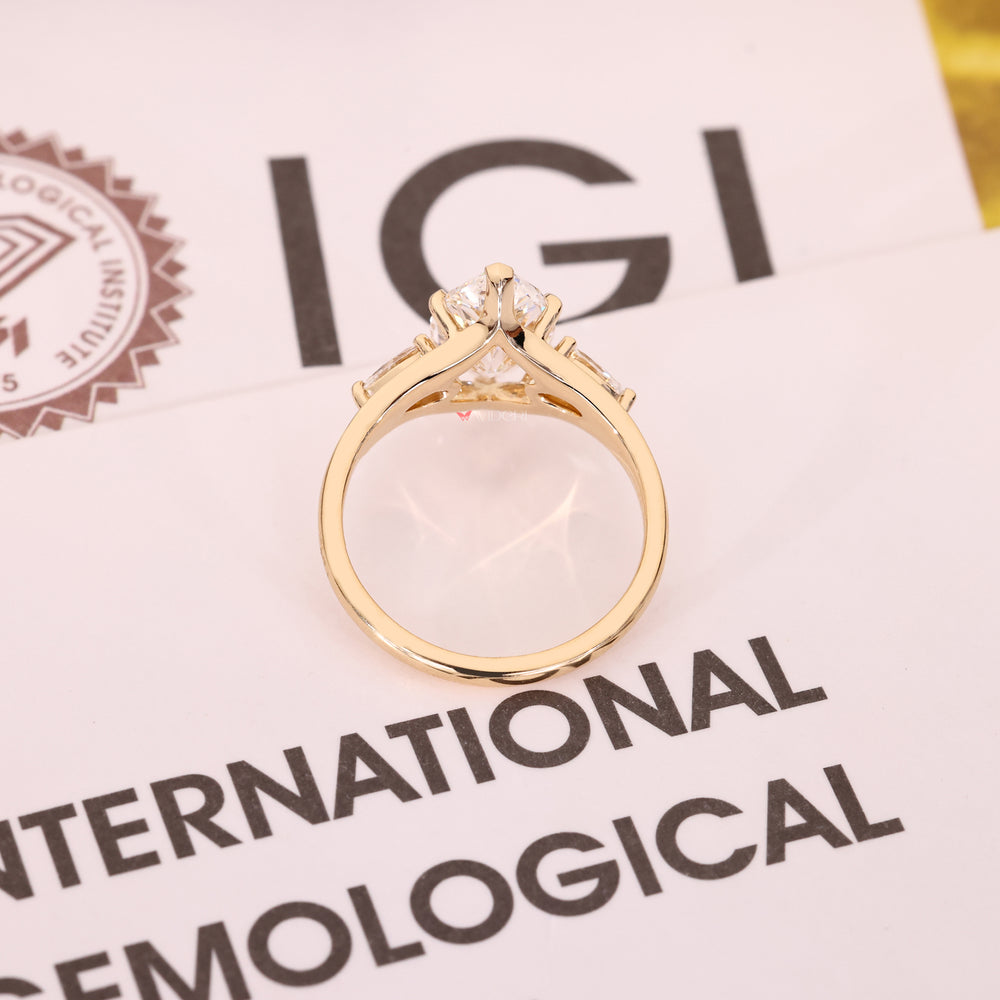 Yellow gold three stone diamond ring.